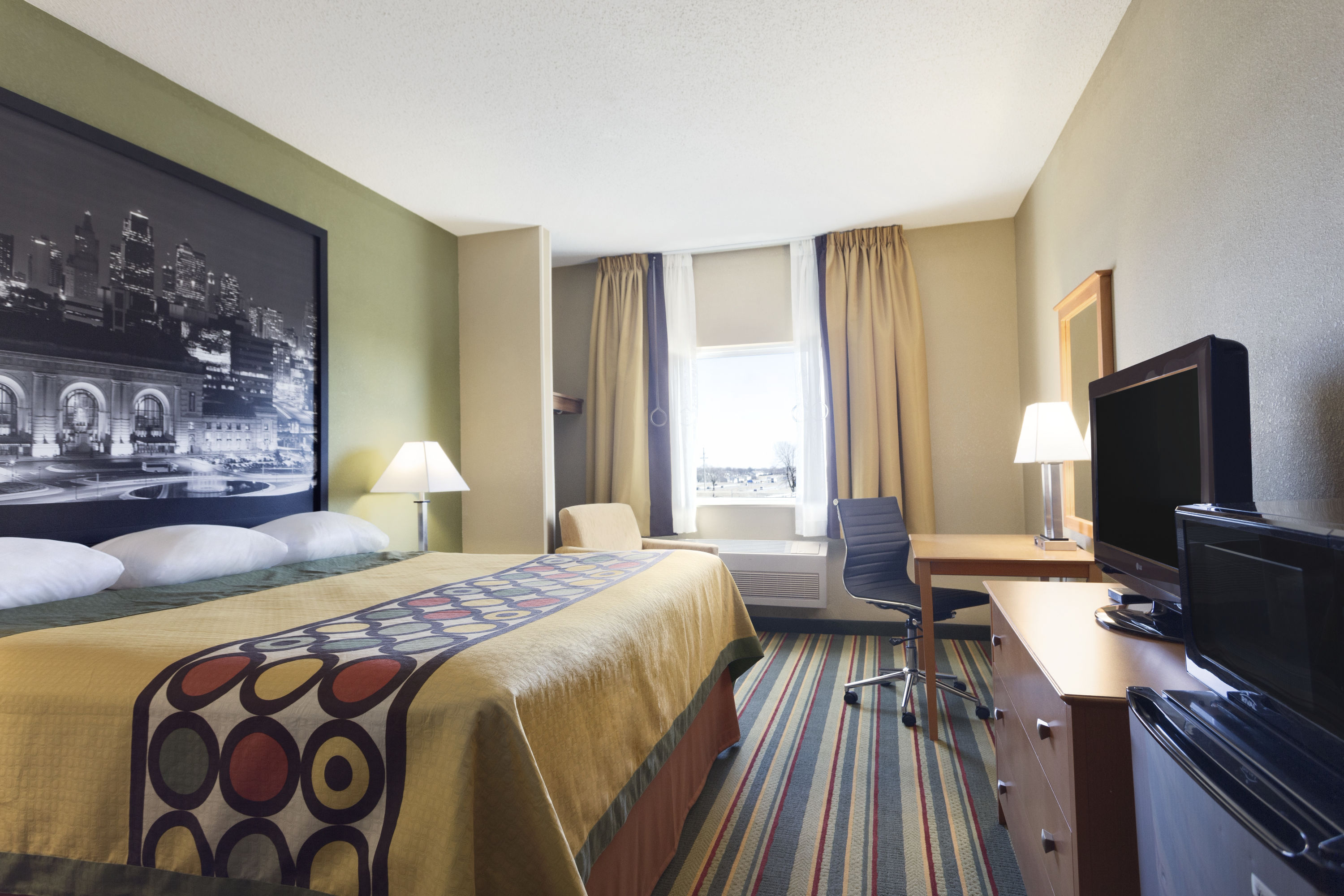 Guest room at the Super 8 by Wyndham Lees Summit in Lees Summit, Missouri