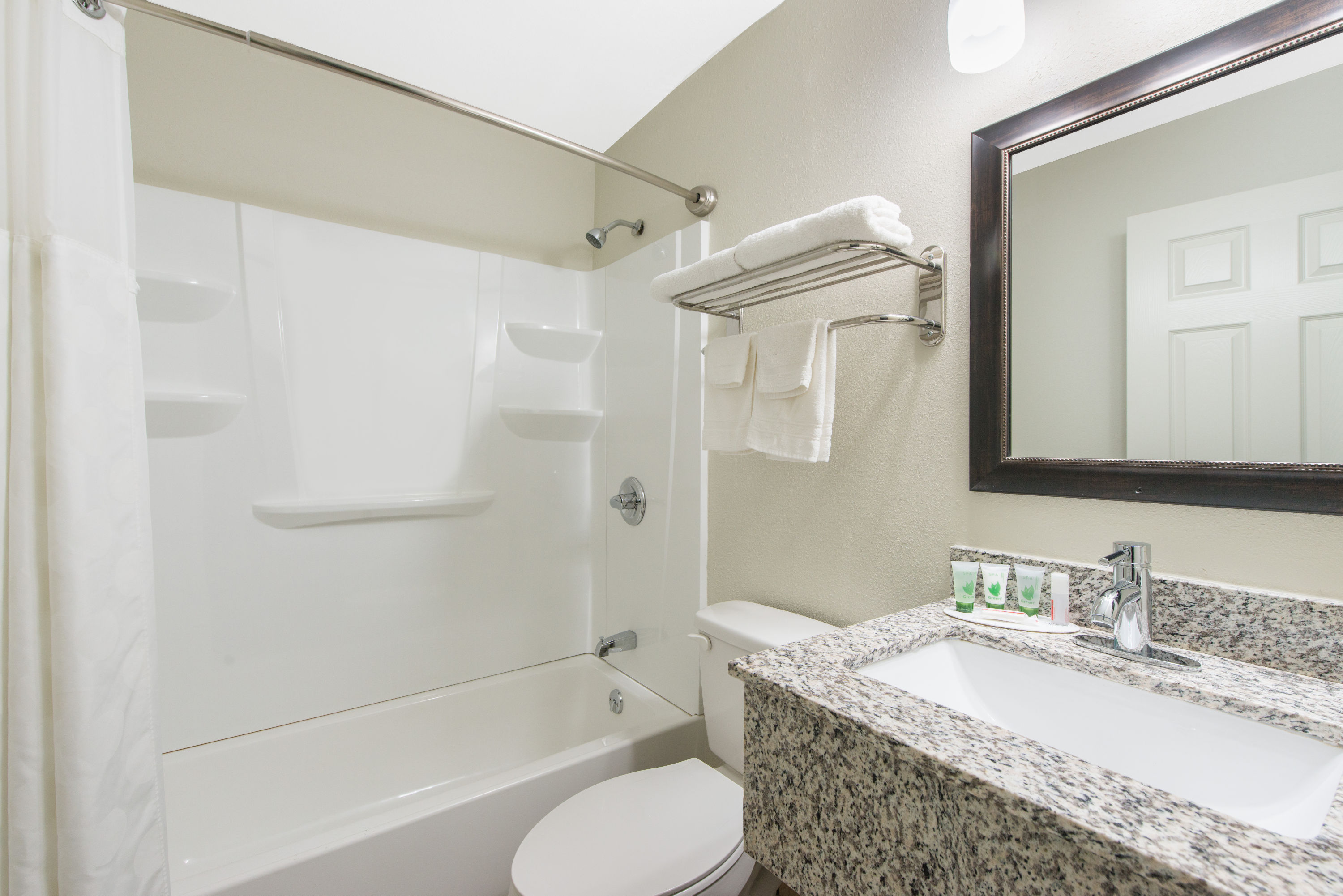 Guest room bath at the Super 8 by Wyndham Moberly MO in Moberly, Missouri