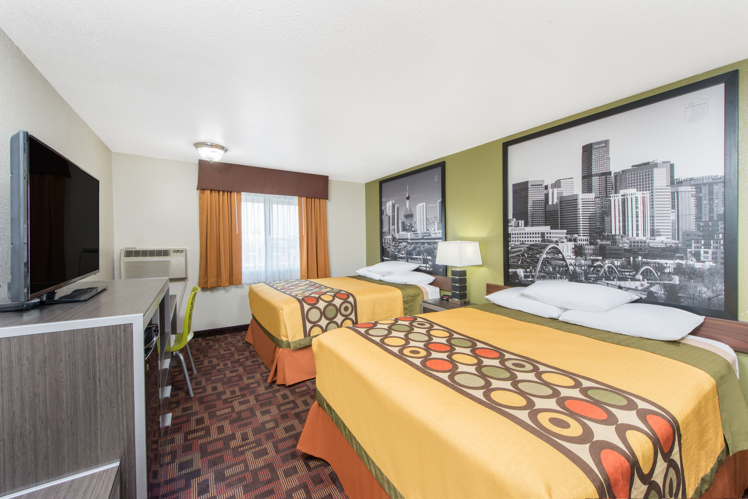 Guest room at the Super 8 by Wyndham Moberly MO in Moberly, Missouri