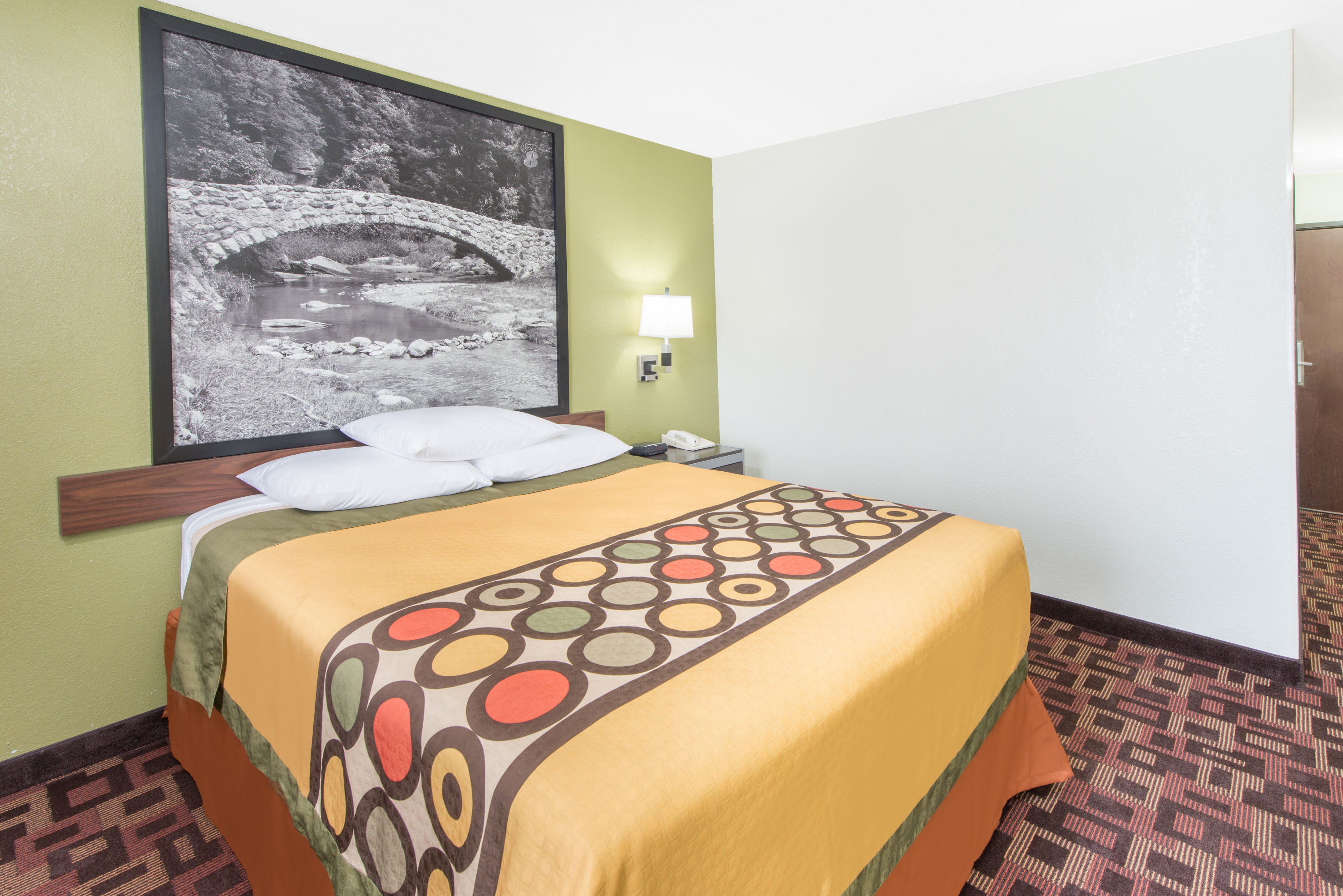 Guest room at the Super 8 by Wyndham Moberly MO in Moberly, Missouri