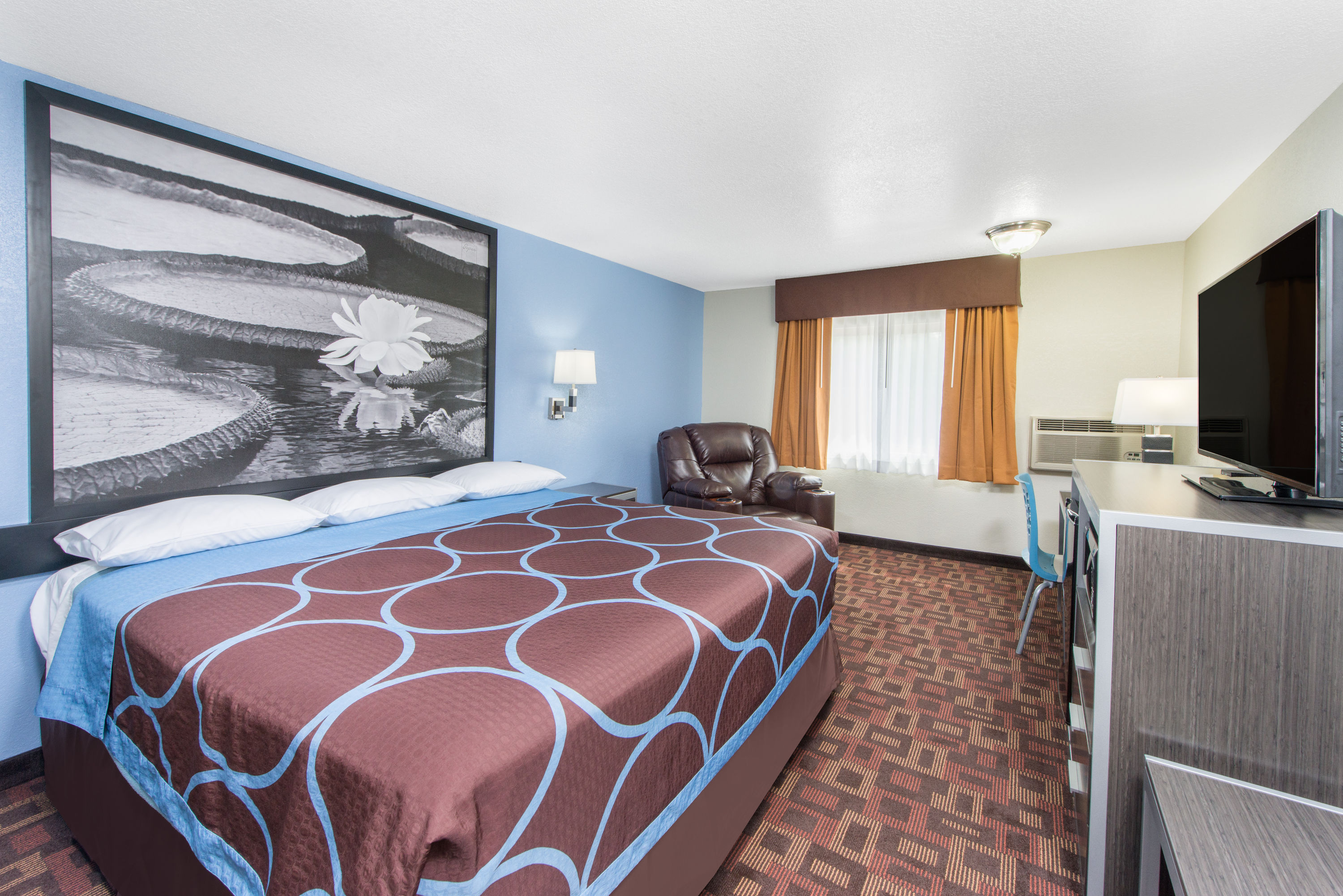 Guest room at the Super 8 by Wyndham Moberly MO in Moberly, Missouri
