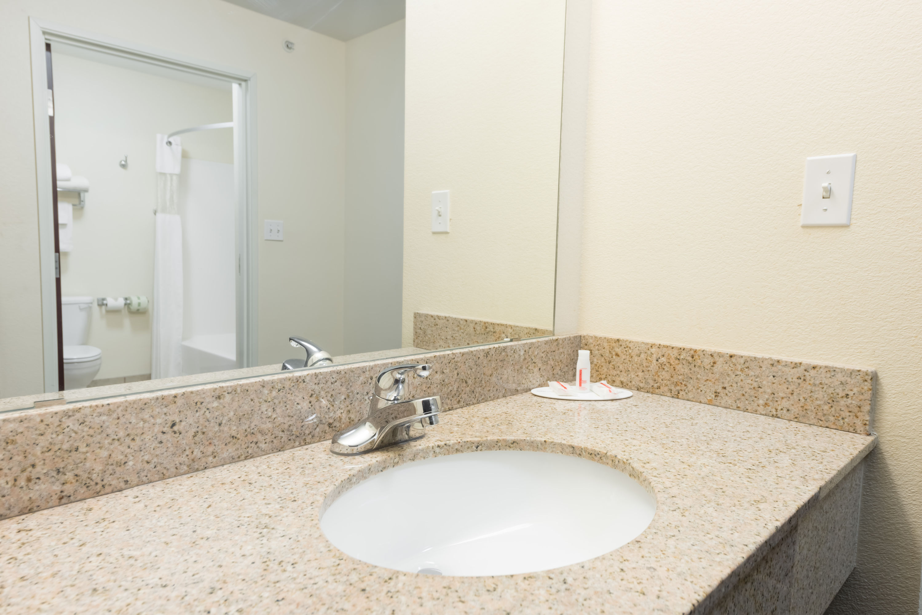 Guest room bath at the Super 8 by Wyndham Rolla in Rolla, Missouri