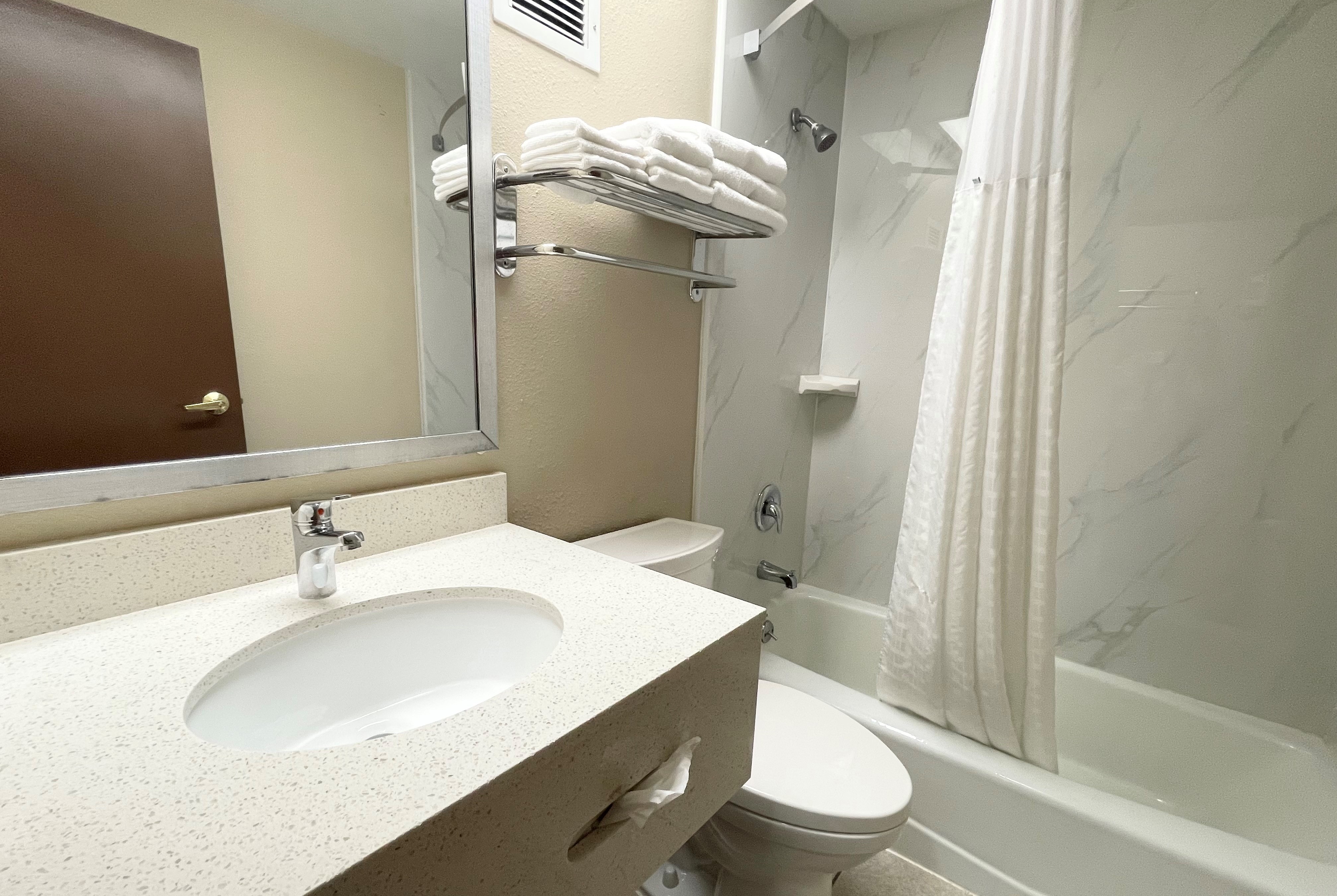 Guest room bath at the Super 8 by Wyndham St Charles in Saint Charles, Missouri