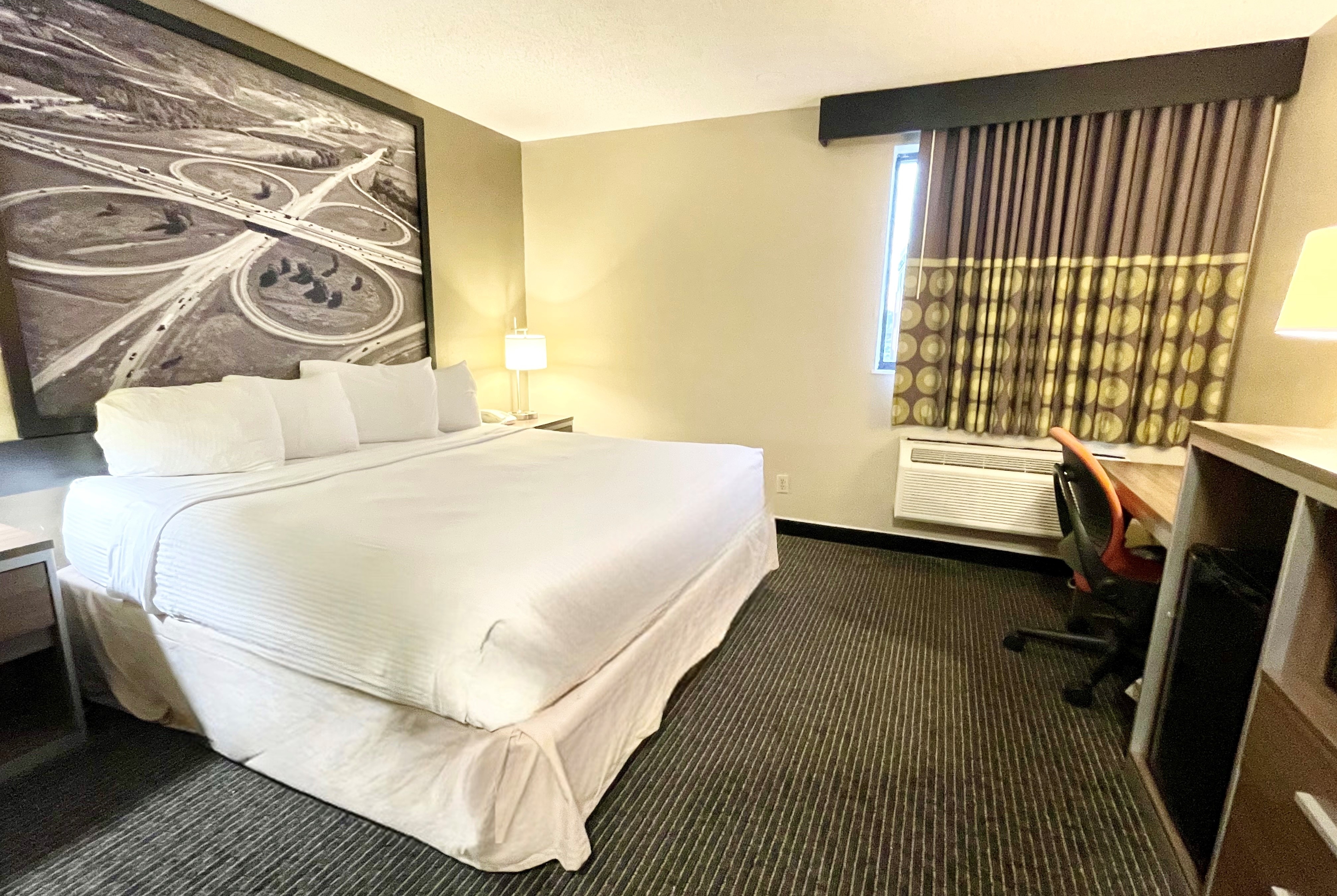Guest room at the Super 8 by Wyndham St Charles in Saint Charles, Missouri