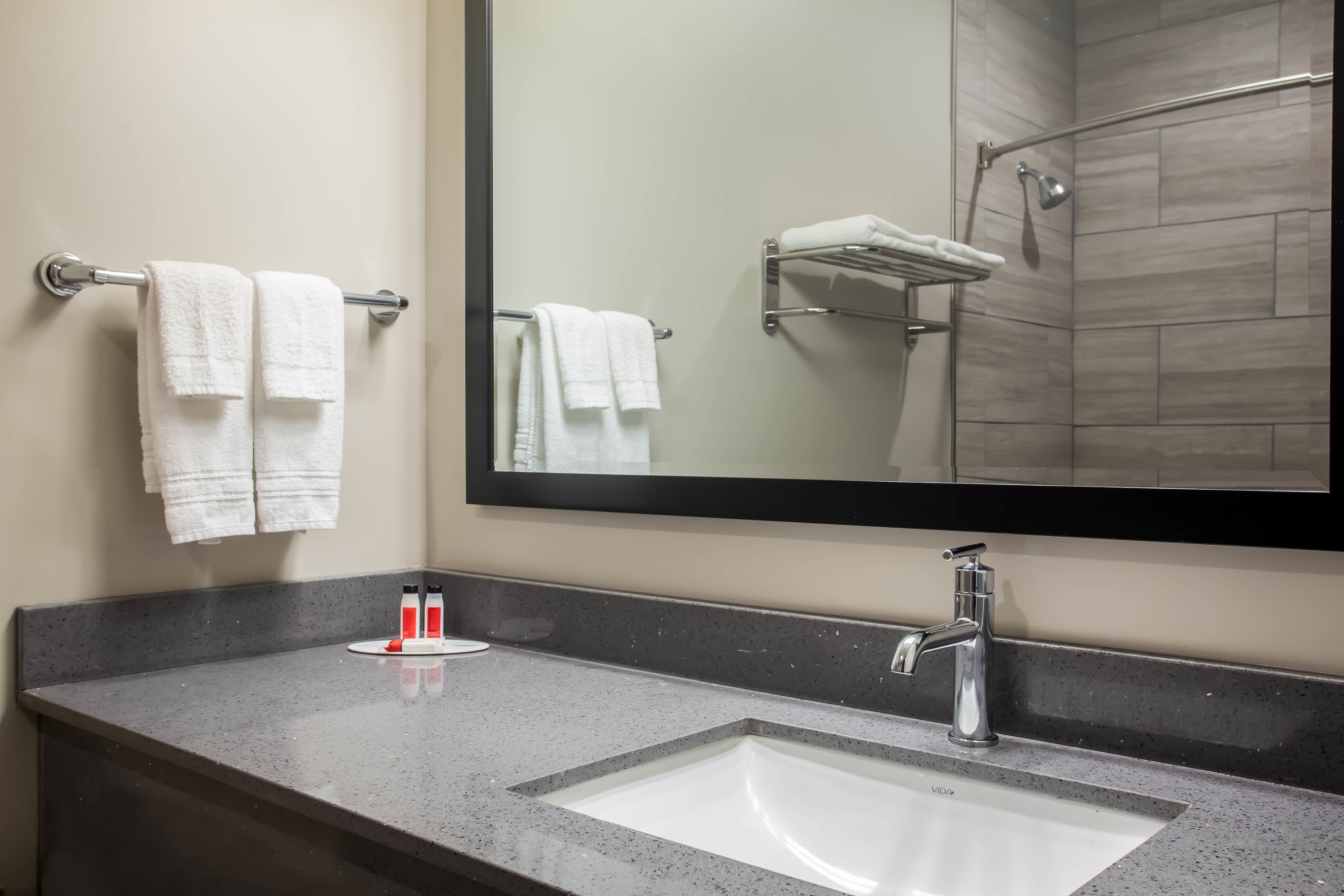 Guest room bath at the Super 8 by Wyndham St. Louis North in Saint Louis, Missouri
