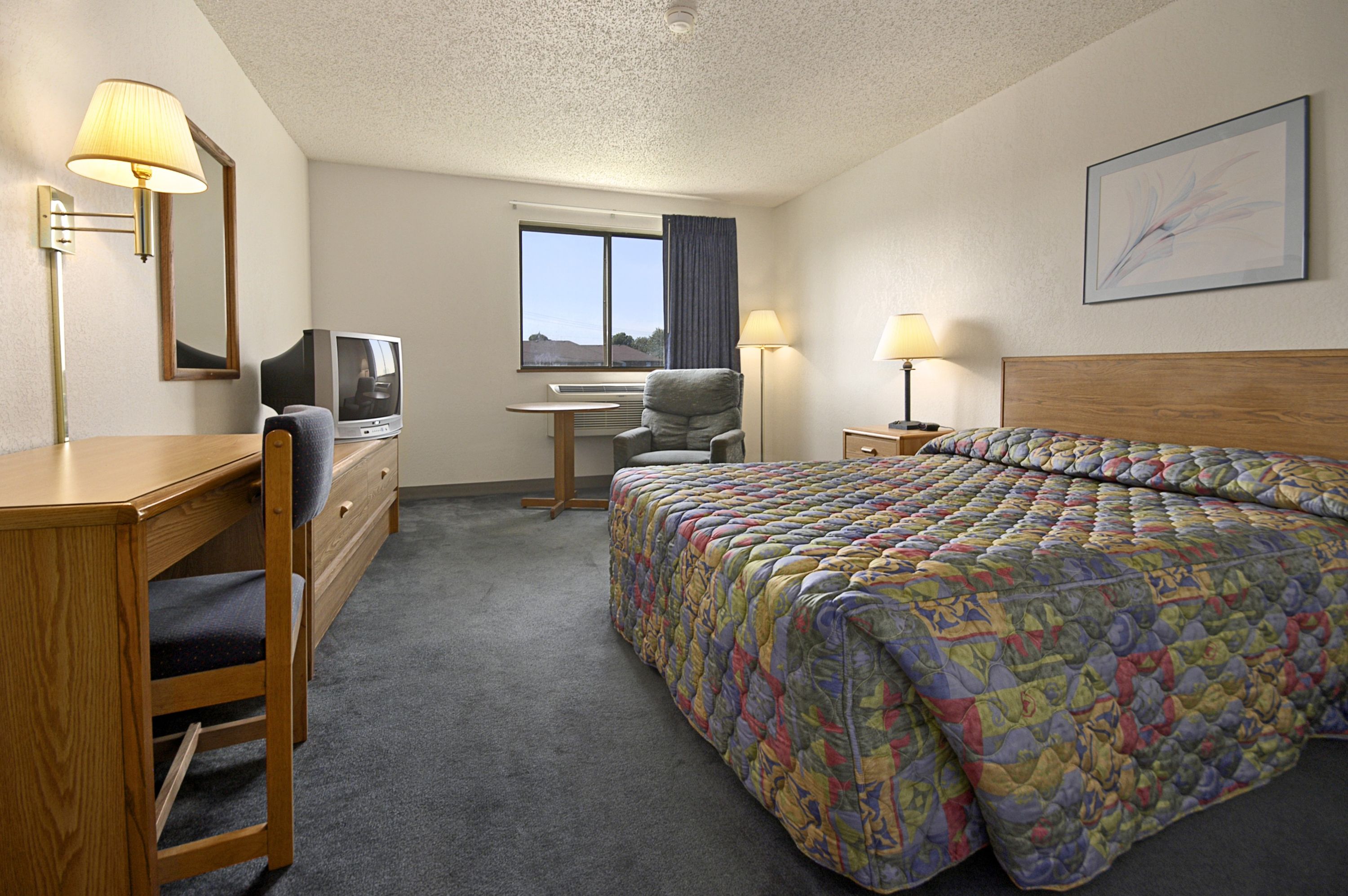 Guest room at the Super 8 by Wyndham Springfield North I-44 in Springfield, Missouri