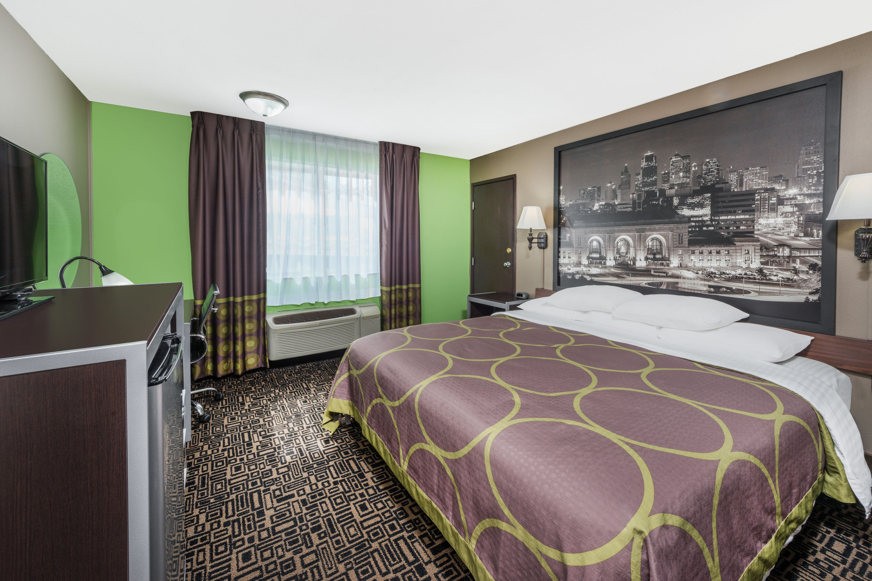 Guest room at the Super 8 by Wyndham Warrensburg in Warrensburg, Missouri