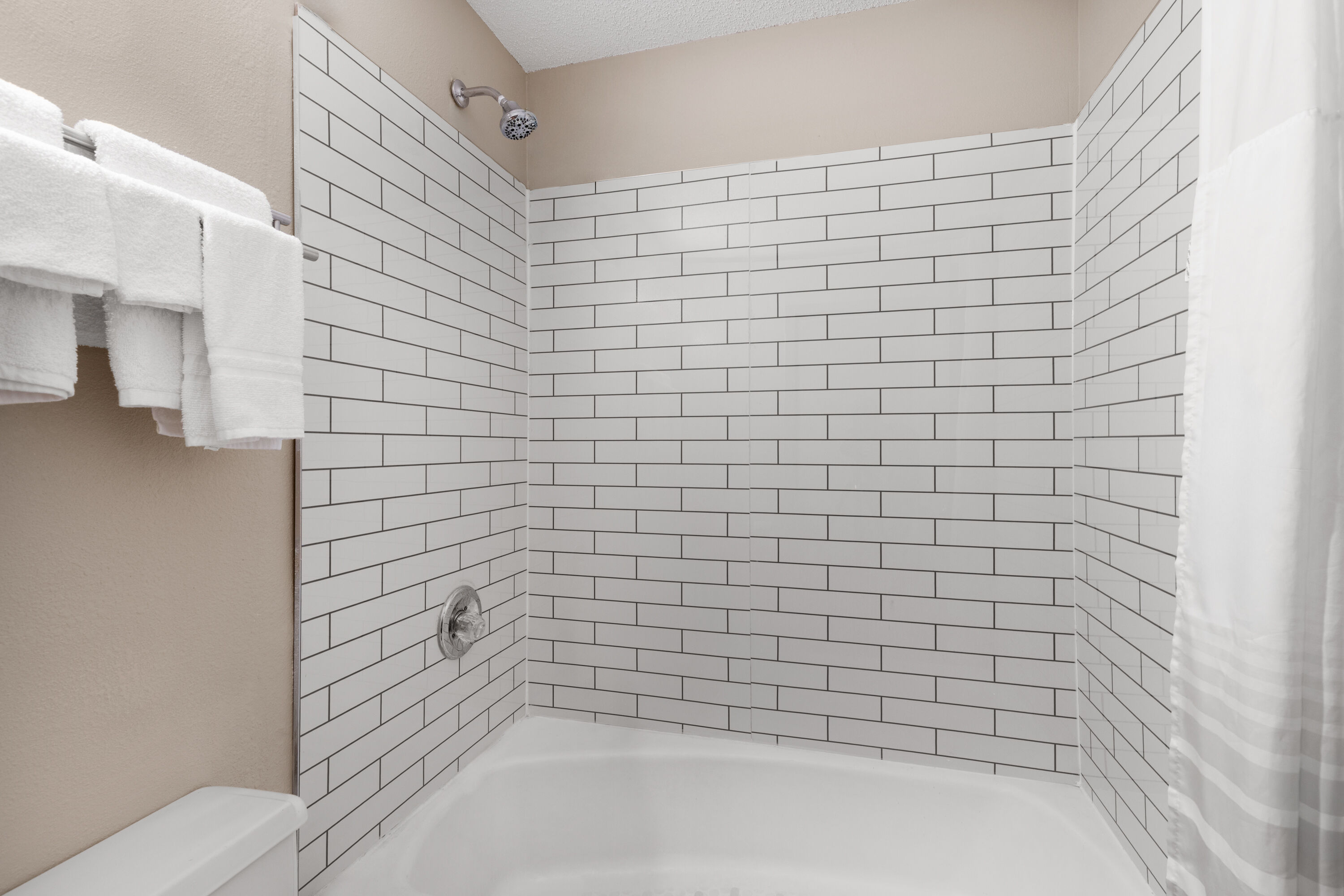 Guest room bath at the Super 8 by Wyndham Biloxi at the Beach in Biloxi, Mississippi
