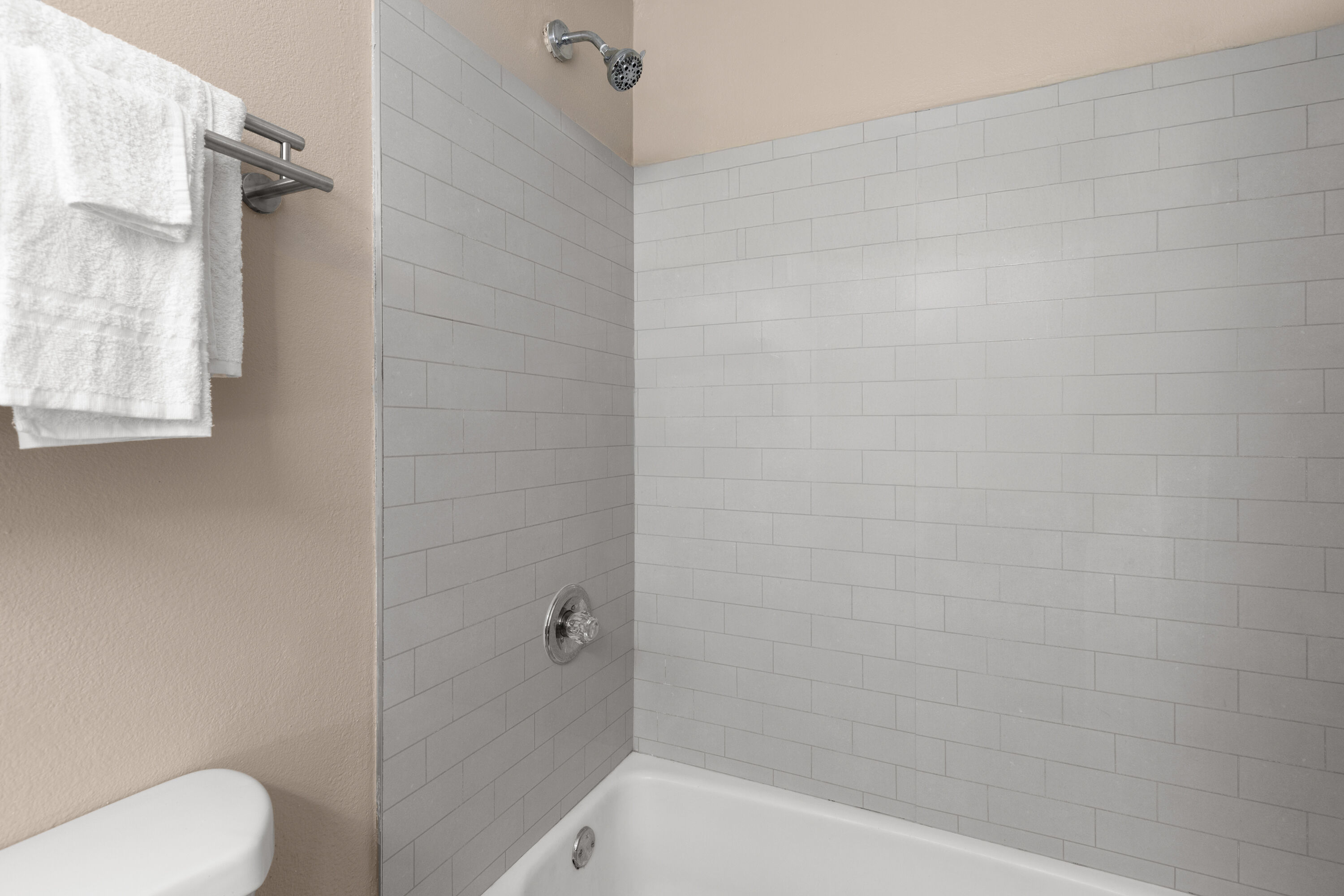 Guest room bath at the Super 8 by Wyndham Biloxi at the Beach in Biloxi, Mississippi