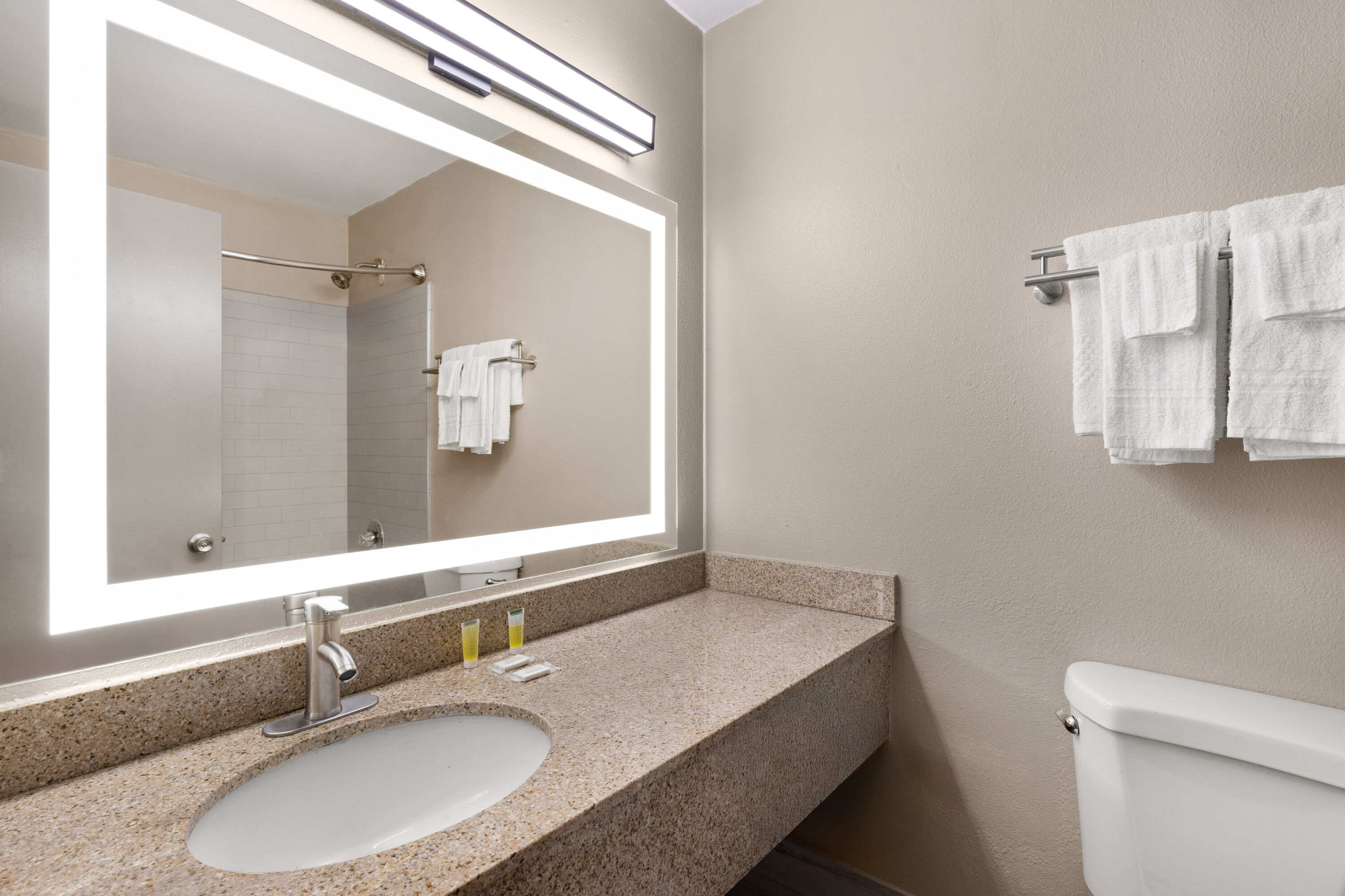 Guest room bath at the Super 8 by Wyndham Biloxi at the Beach in Biloxi, Mississippi