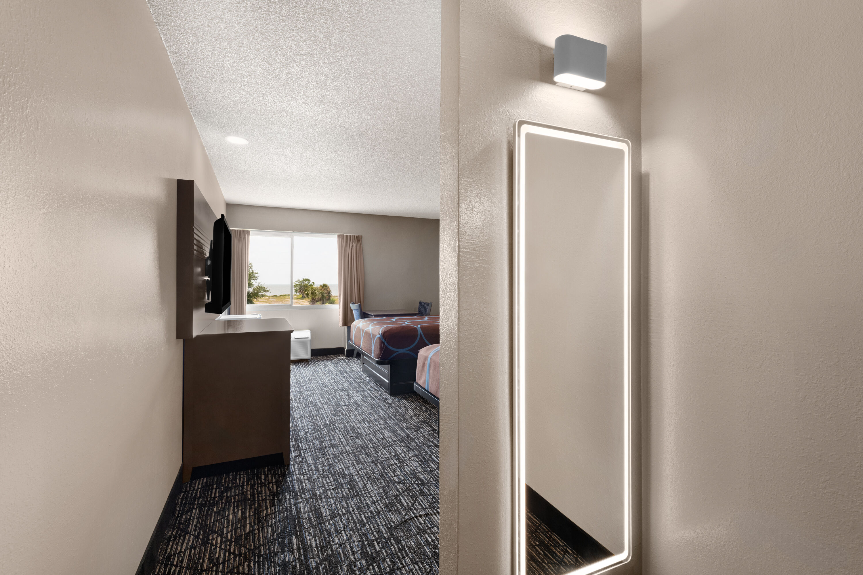 Guest room at the Super 8 by Wyndham Biloxi at the Beach in Biloxi, Mississippi
