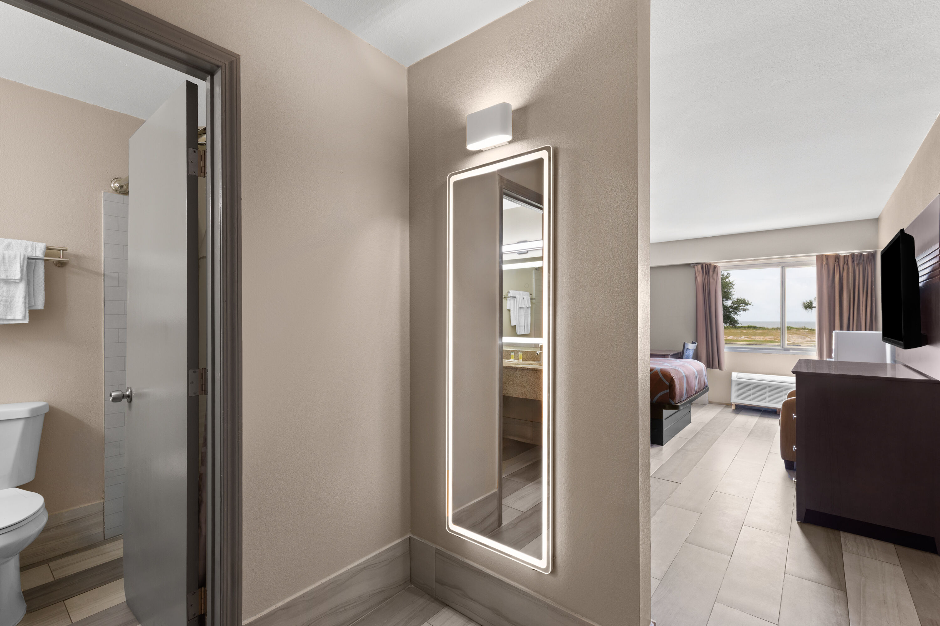 Guest room at the Super 8 by Wyndham Biloxi at the Beach in Biloxi, Mississippi