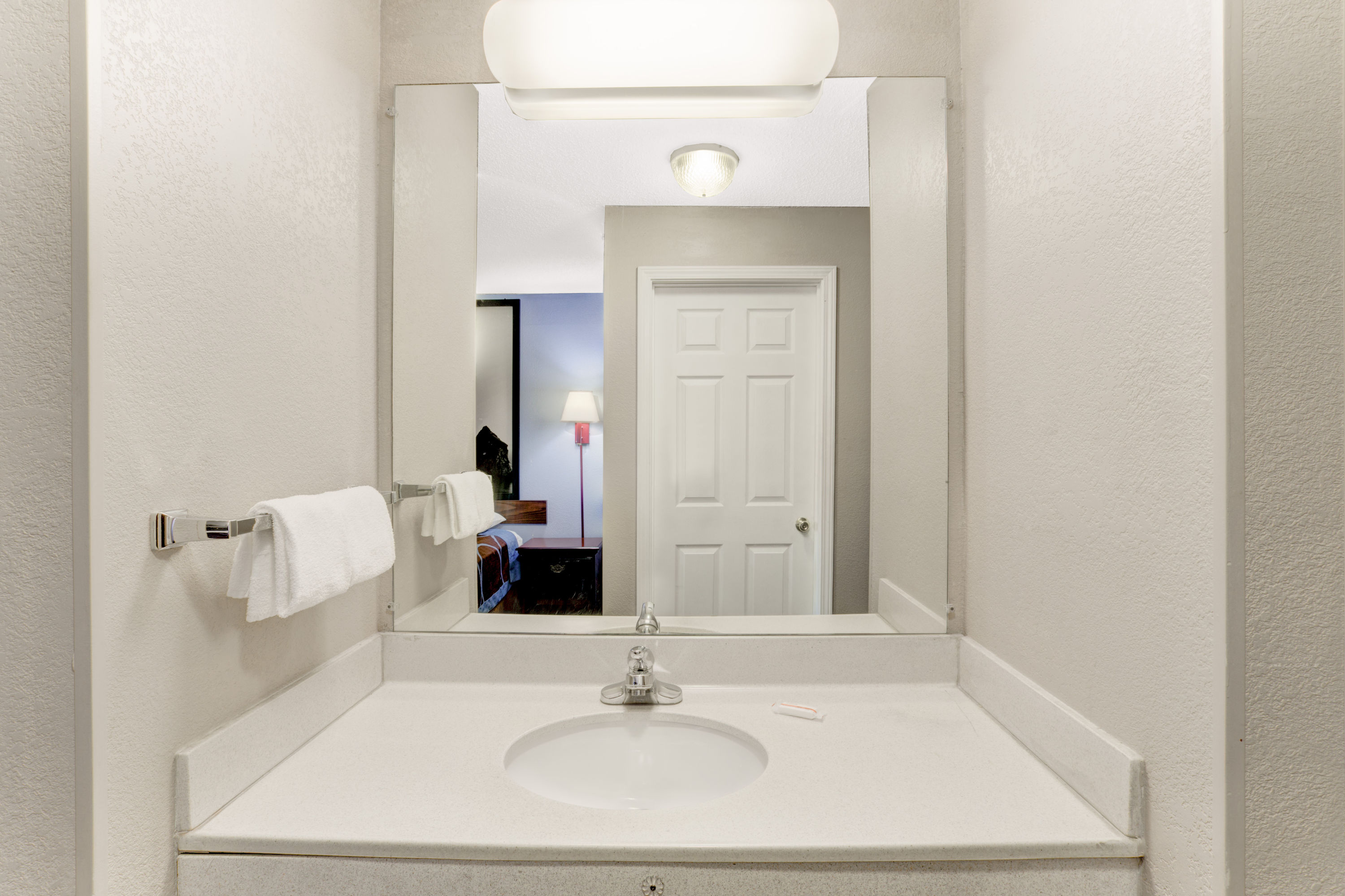 Guest room bath at the Super 8 by Wyndham Booneville in Booneville, Mississippi
