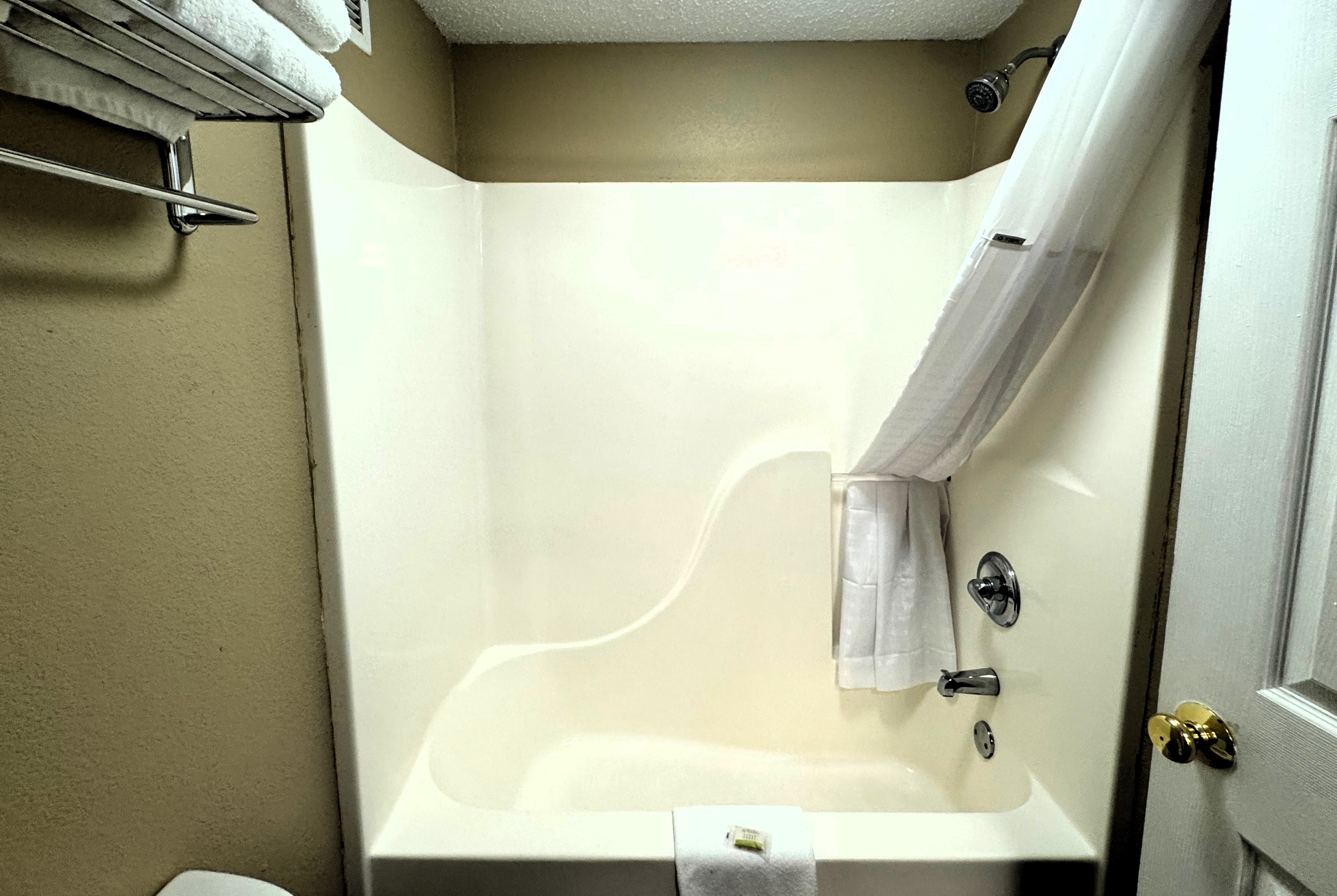 Guest room bath at the Super 8 by Wyndham Booneville in Booneville, Mississippi