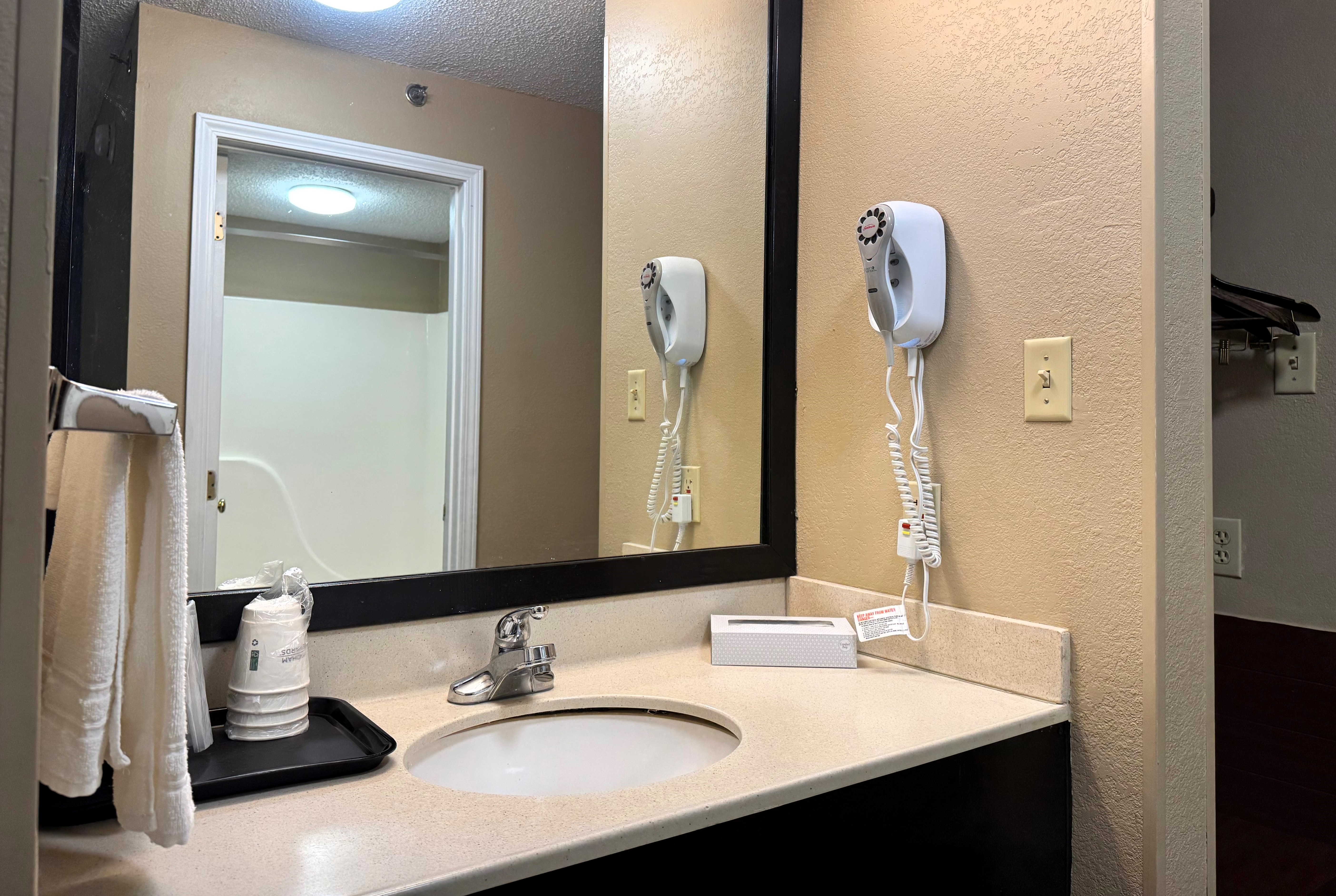 Guest room bath at the Super 8 by Wyndham Booneville in Booneville, Mississippi