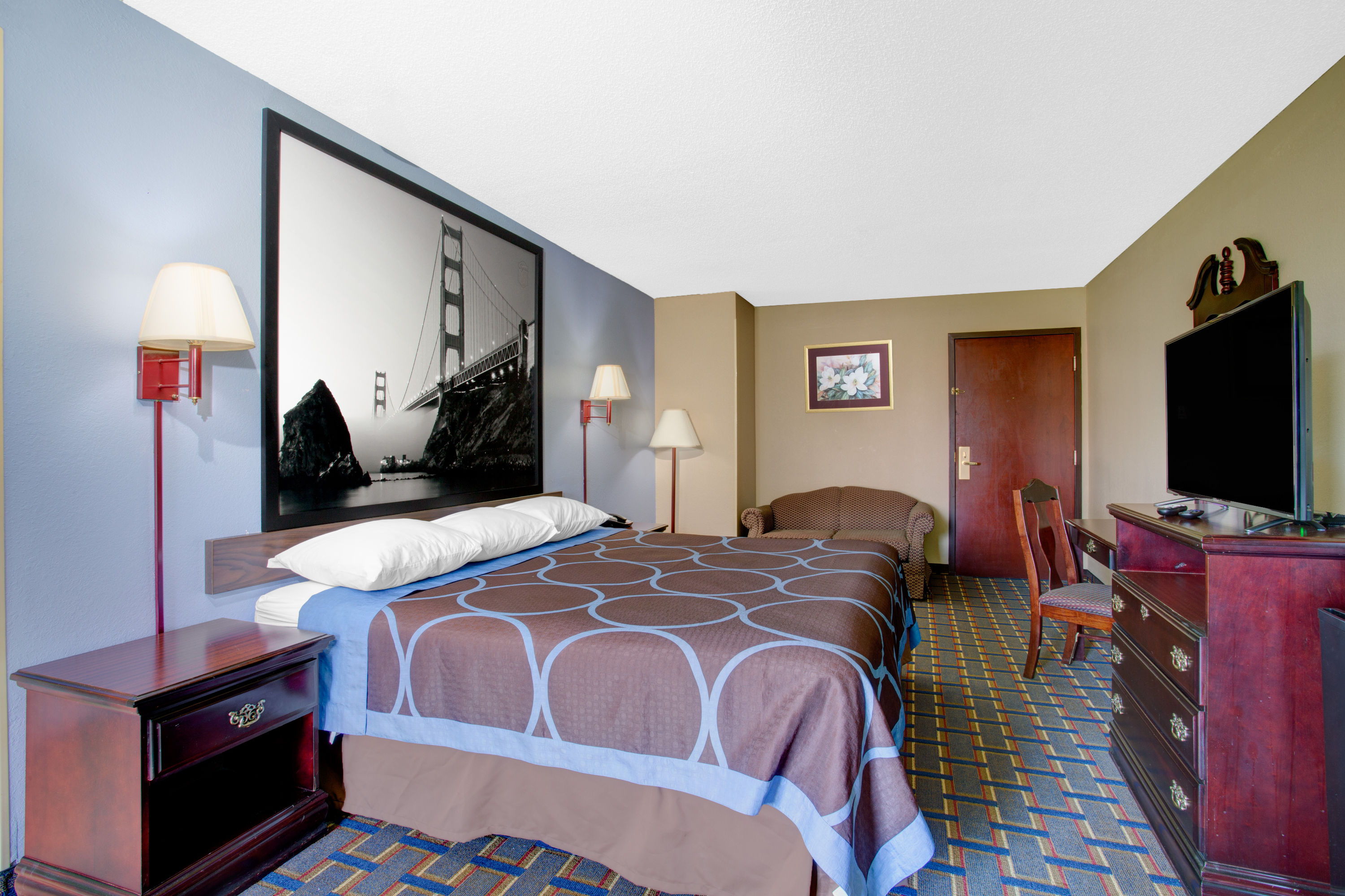 Guest room at the Super 8 by Wyndham Booneville in Booneville, Mississippi