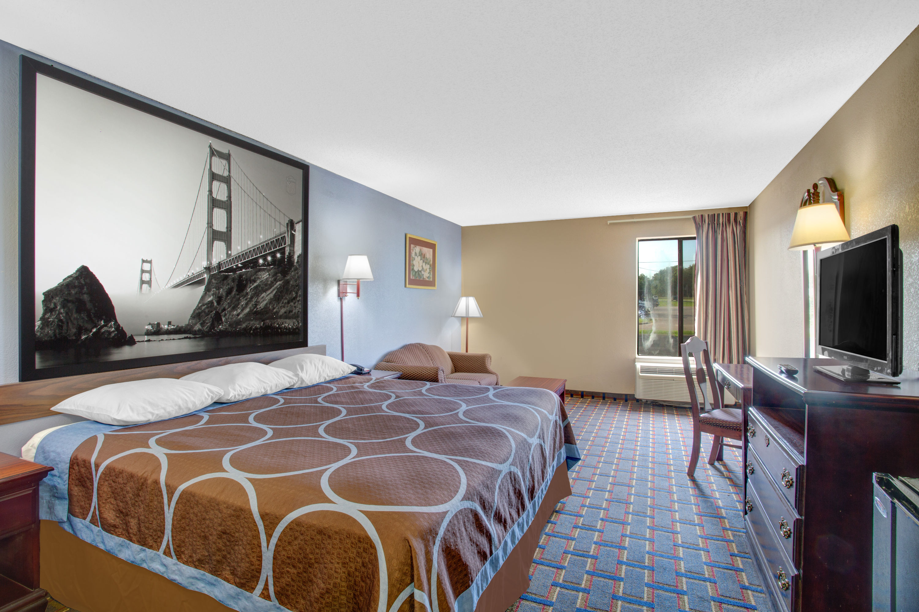 Guest room at the Super 8 by Wyndham Booneville in Booneville, Mississippi