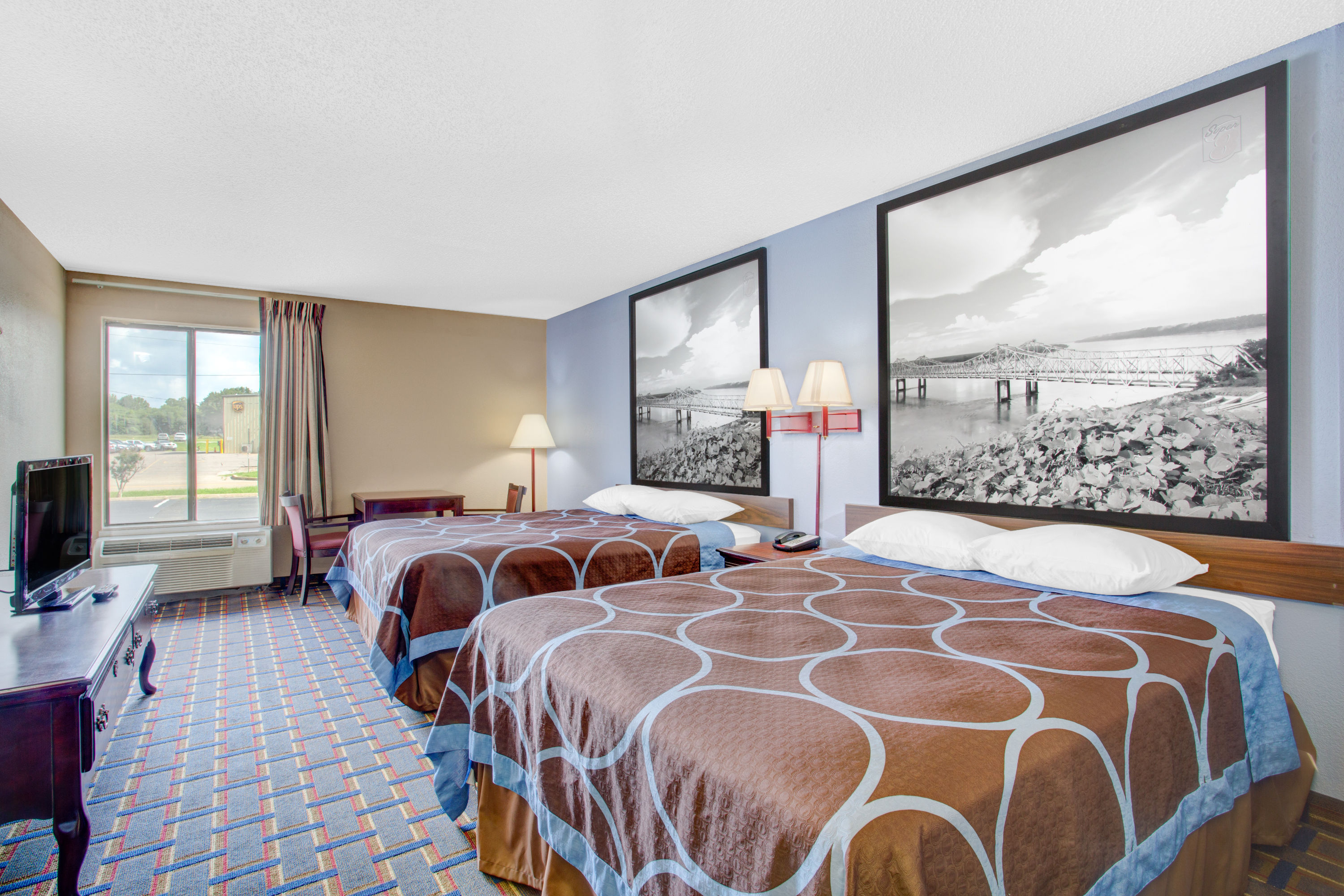 Guest room at the Super 8 by Wyndham Booneville in Booneville, Mississippi
