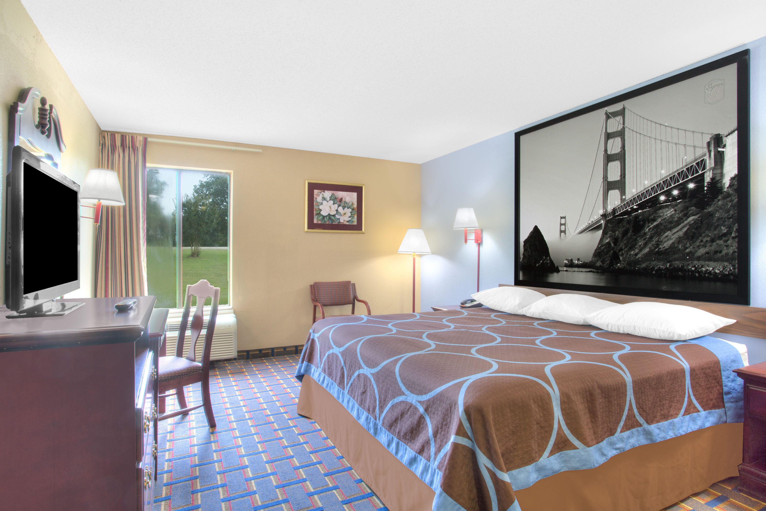Guest room at the Super 8 by Wyndham Booneville in Booneville, Mississippi