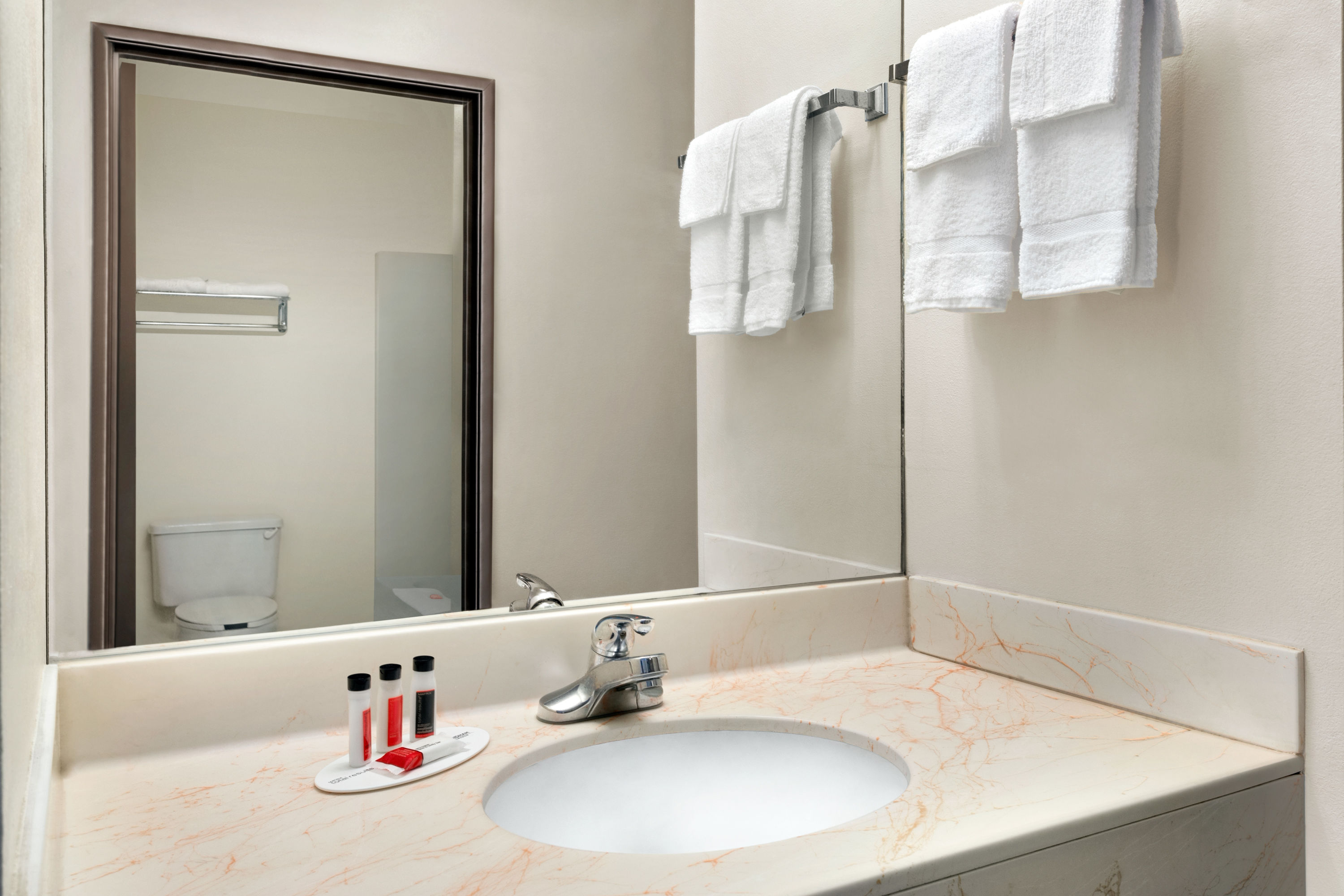 Guest room bath at the Super 8 by Wyndham Clinton in Clinton, Mississippi