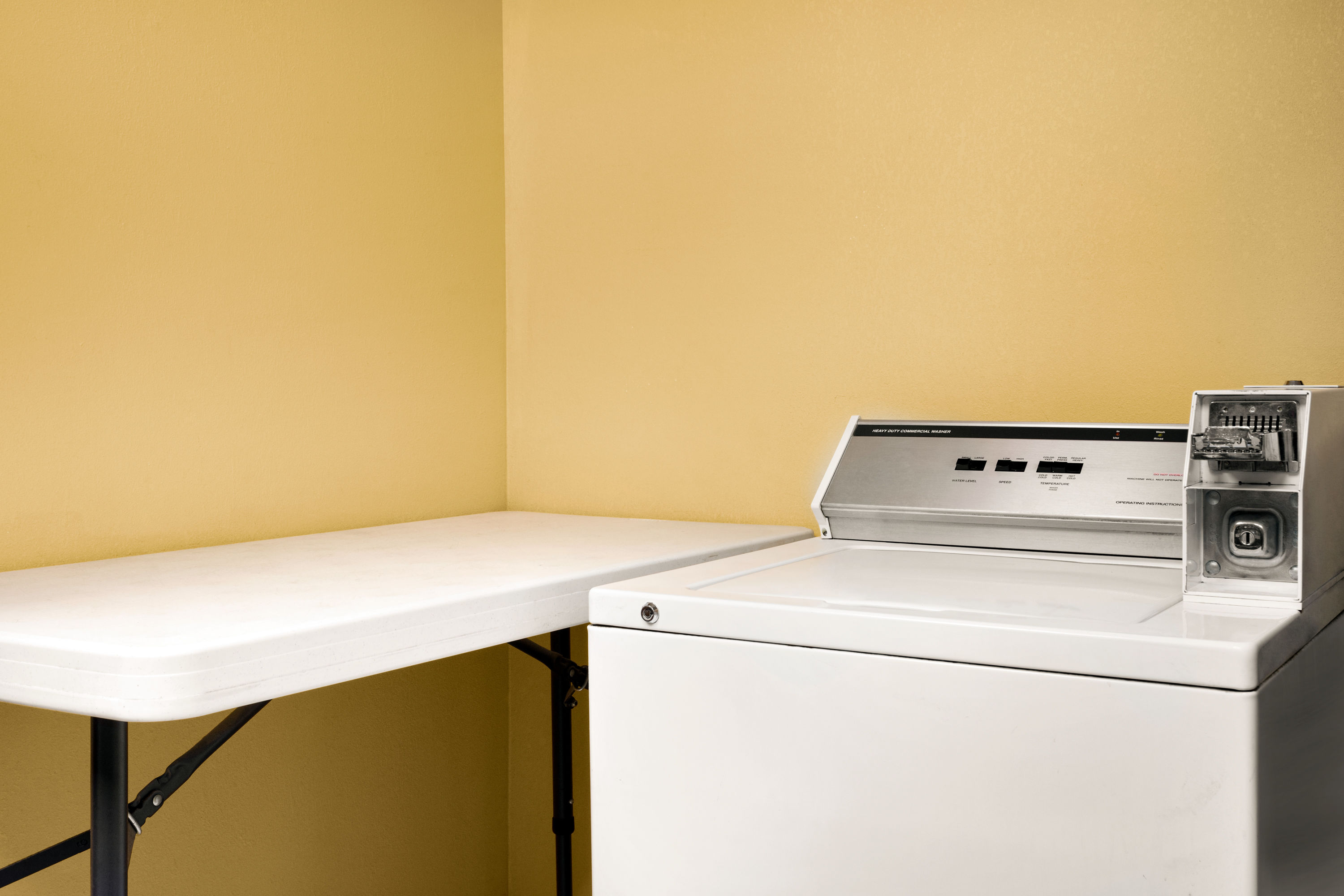 Laundry facilities at Super 8 by Wyndham Clinton in Clinton, Mississippi