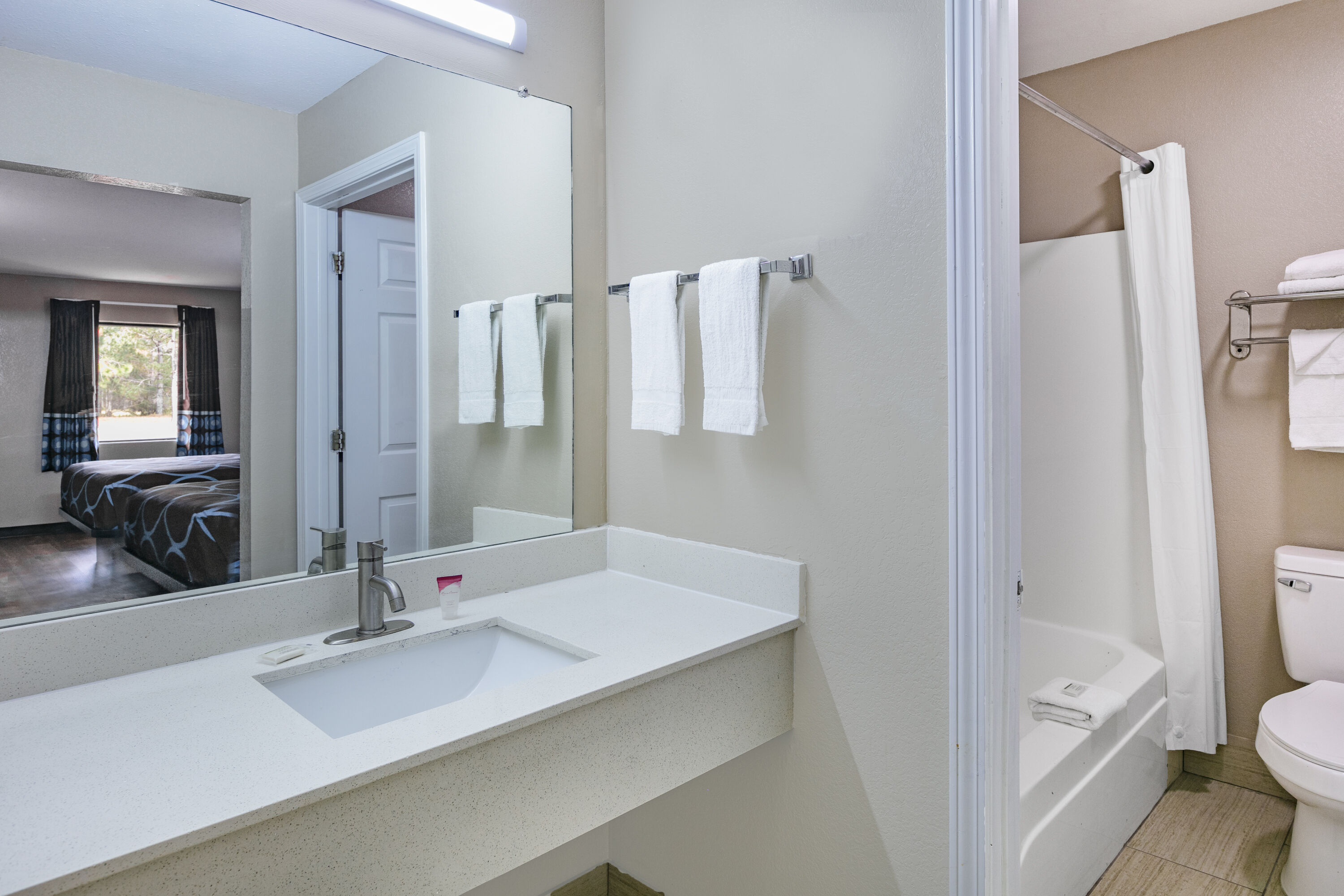Guest room bath at the Super 8 by Wyndham Moss Point in Moss Point, Mississippi