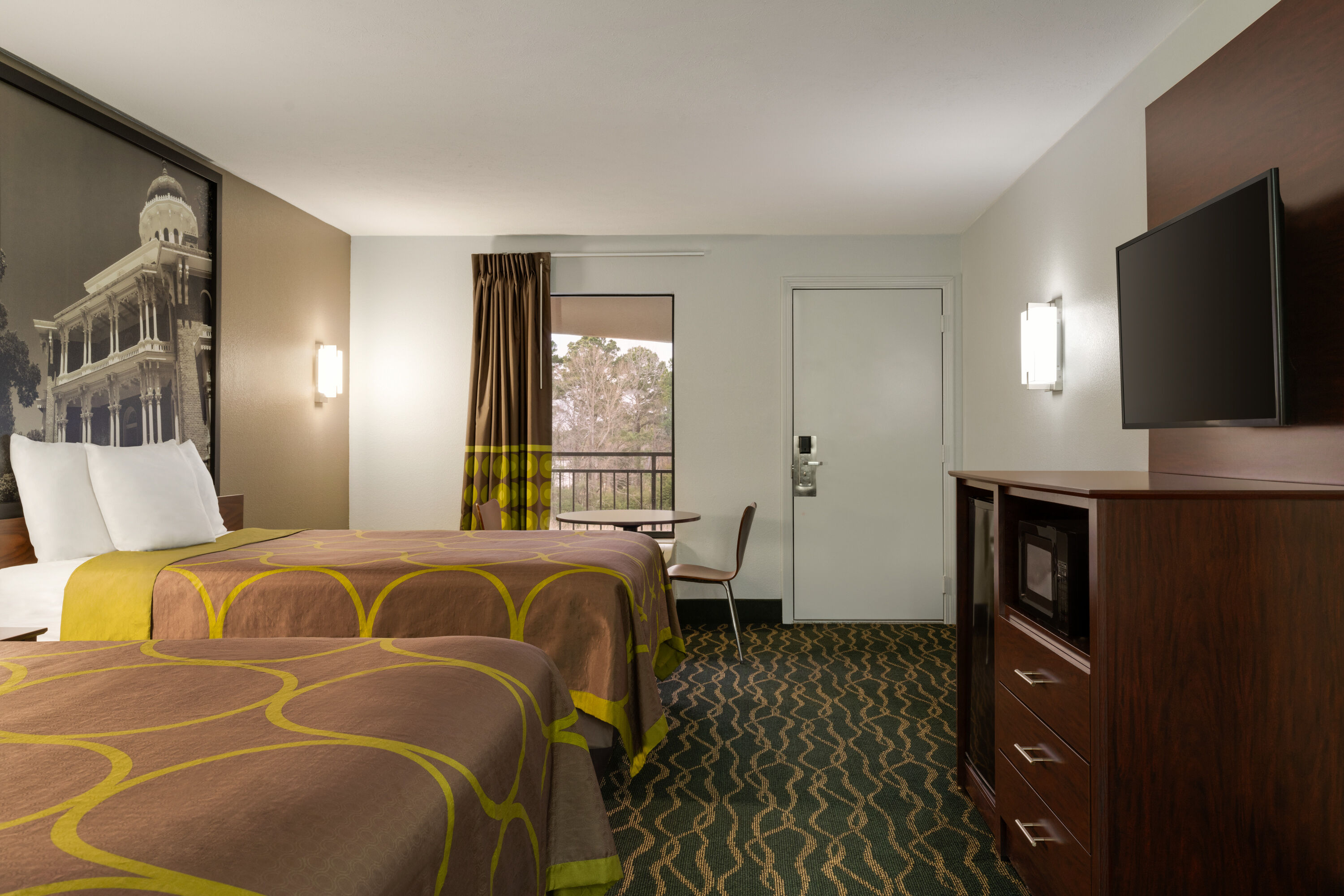 Guest room at the Super 8 by Wyndham Pearl/Jackson/East in Pearl, Mississippi
