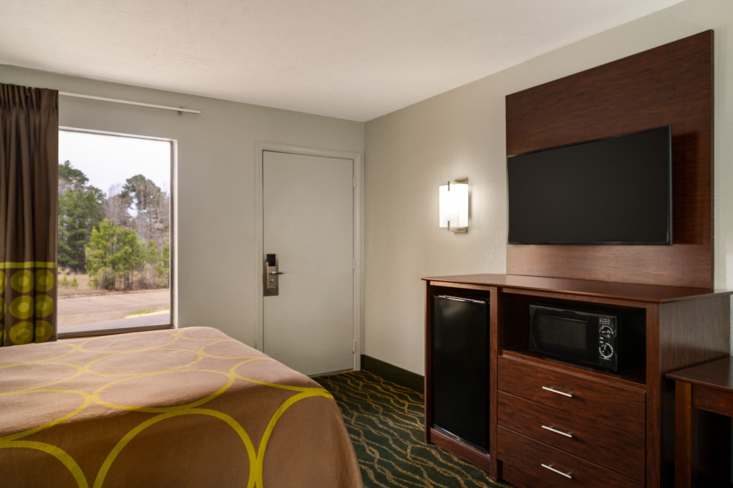 Guest room at the Super 8 by Wyndham Pearl/Jackson/East in Pearl, Mississippi
