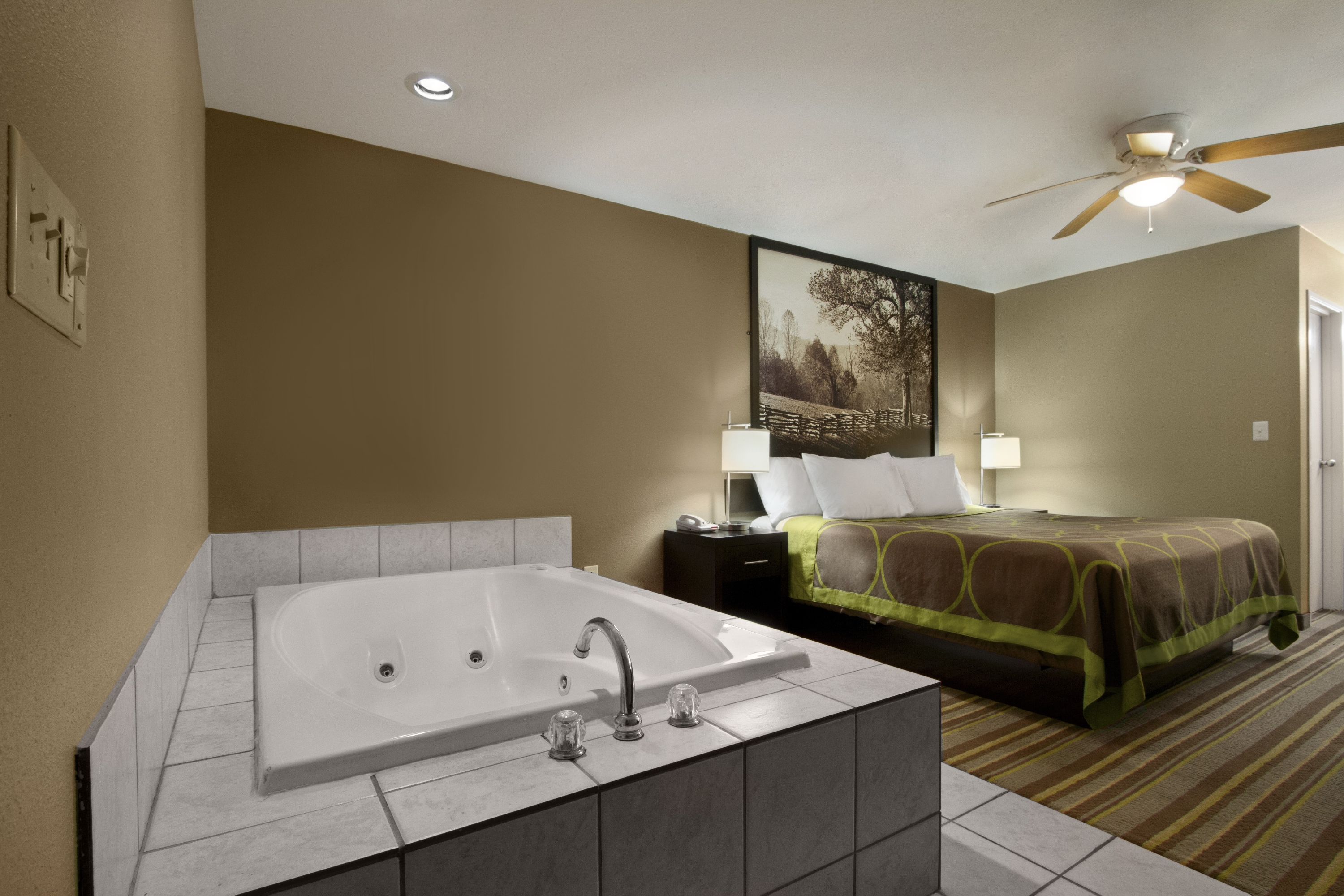 Guest room at the Super 8 by Wyndham Tupelo Airport in Tupelo, Mississippi