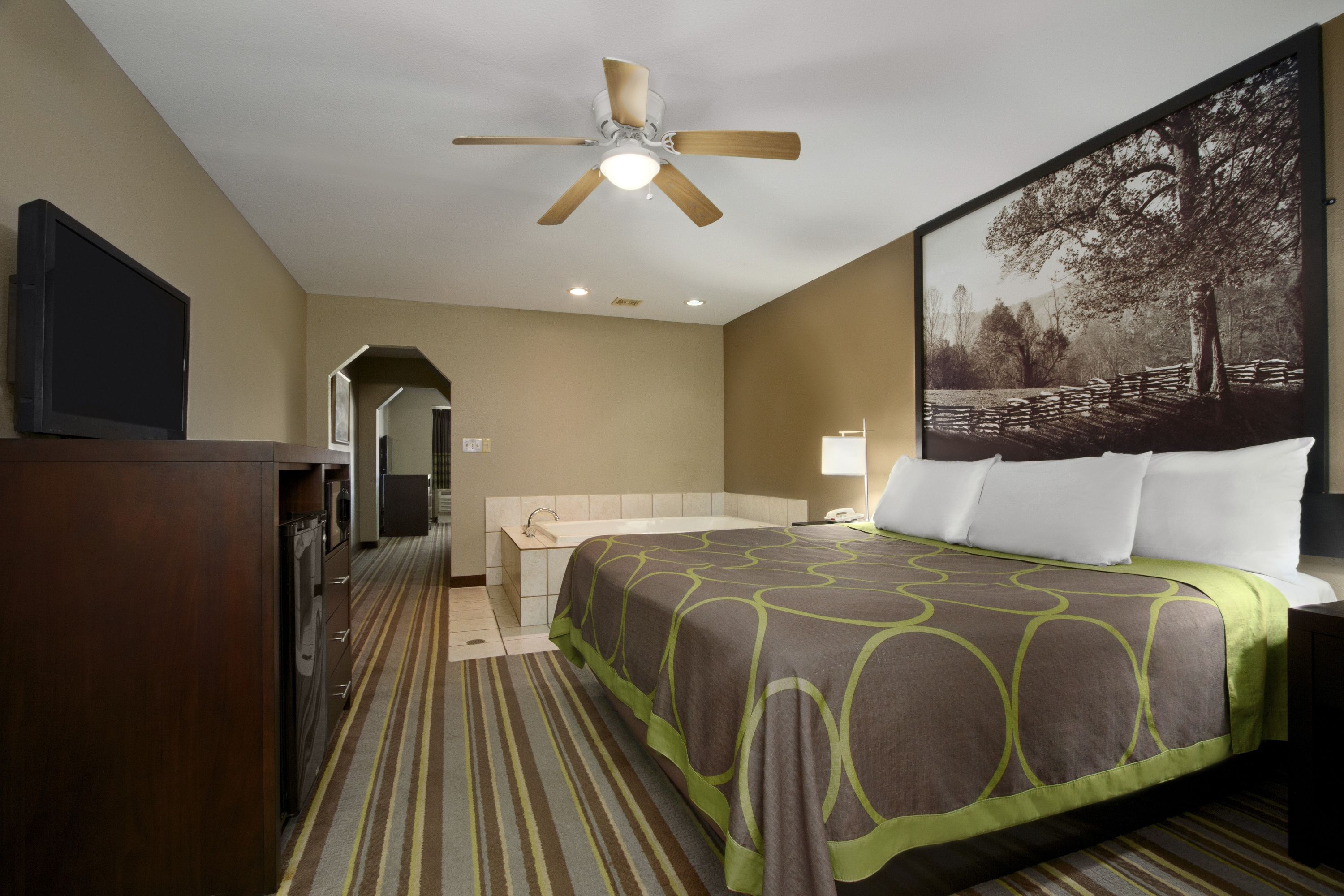 Guest room at the Super 8 by Wyndham Tupelo Airport in Tupelo, Mississippi