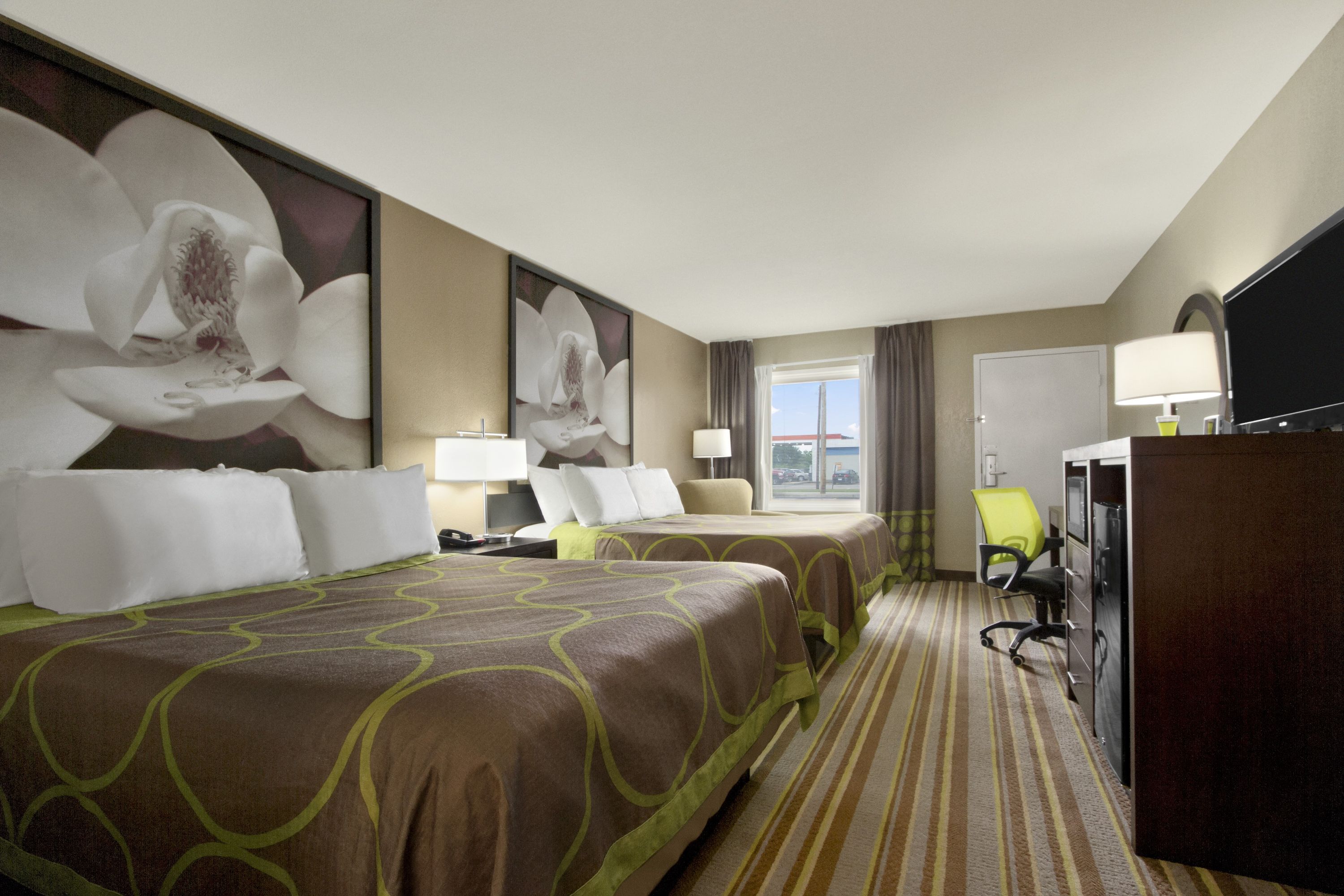 Guest room at the Super 8 by Wyndham Tupelo Airport in Tupelo, Mississippi