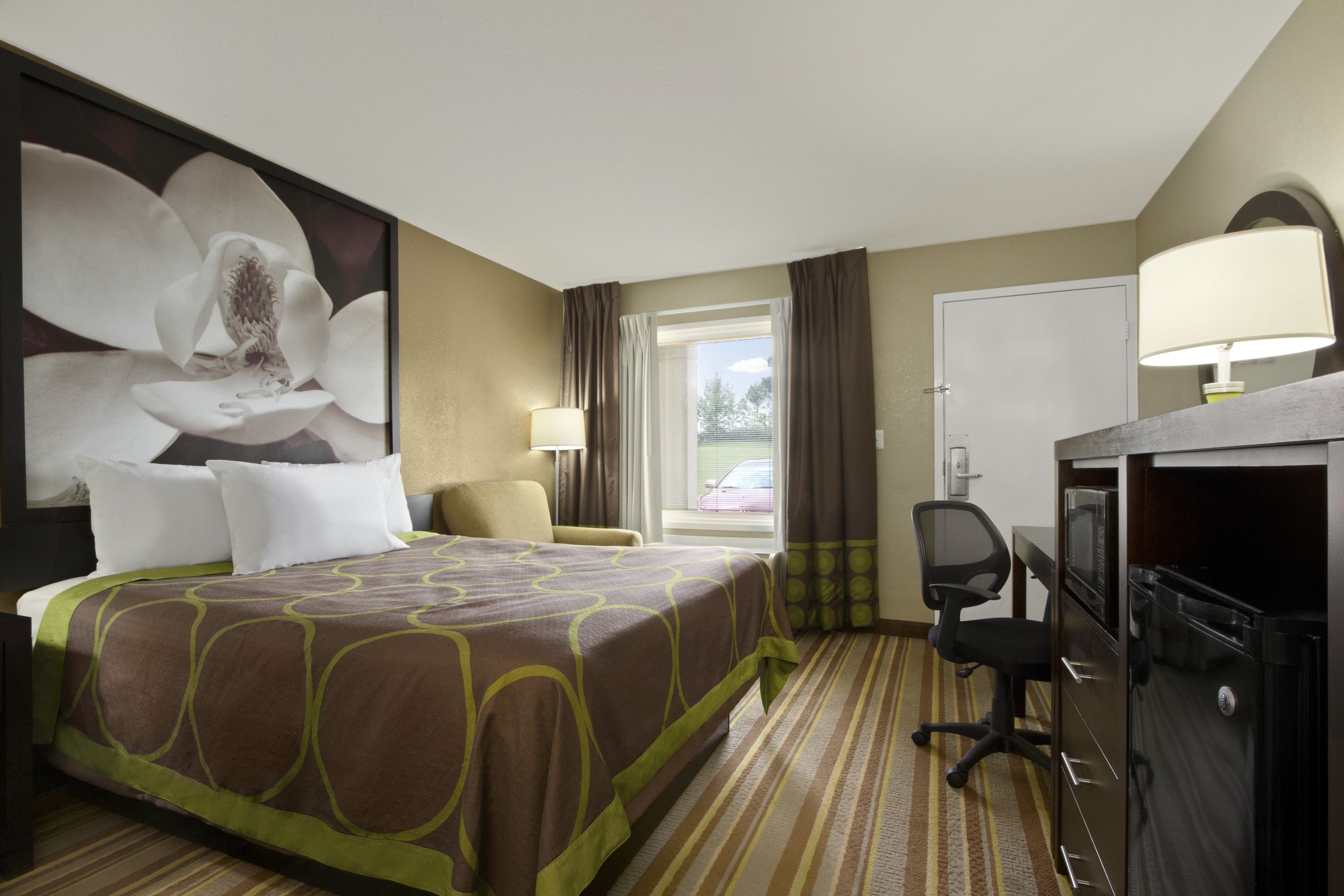 Guest room at the Super 8 by Wyndham Tupelo Airport in Tupelo, Mississippi
