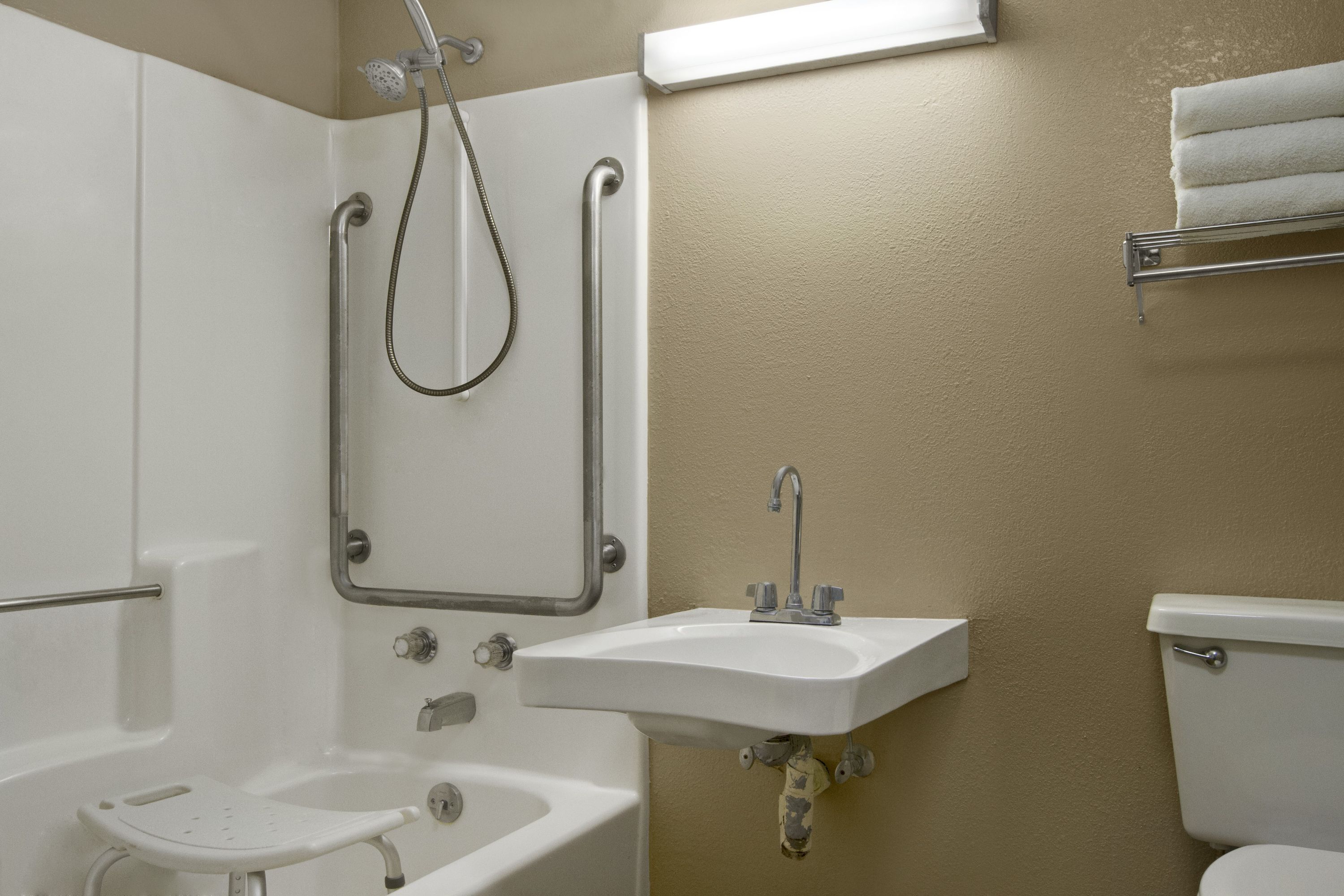 Guest room at the Super 8 by Wyndham Tupelo Airport in Tupelo, Mississippi