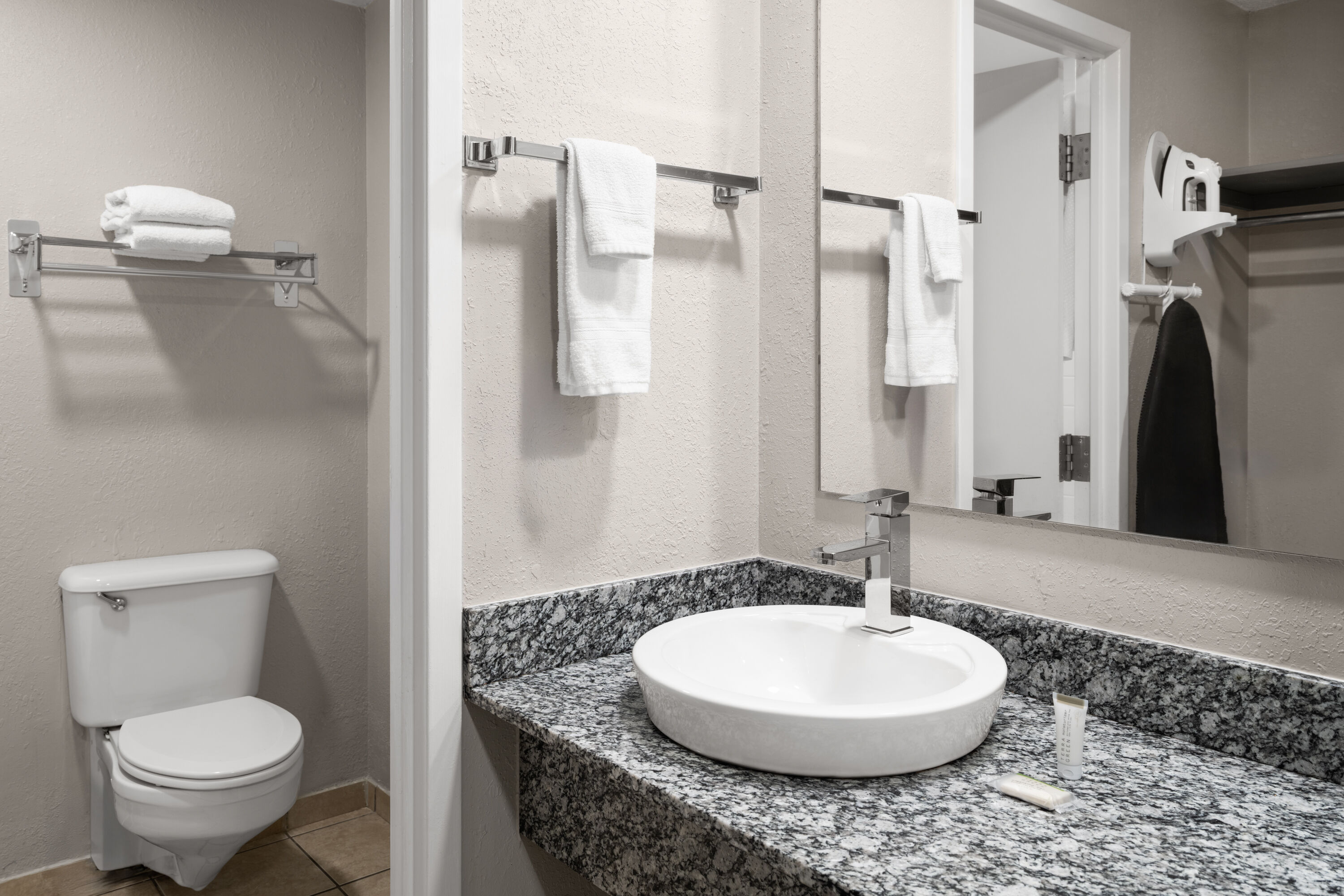 Guest room bath at the Super 8 by Wyndham Great Falls City Center in Great Falls, Montana