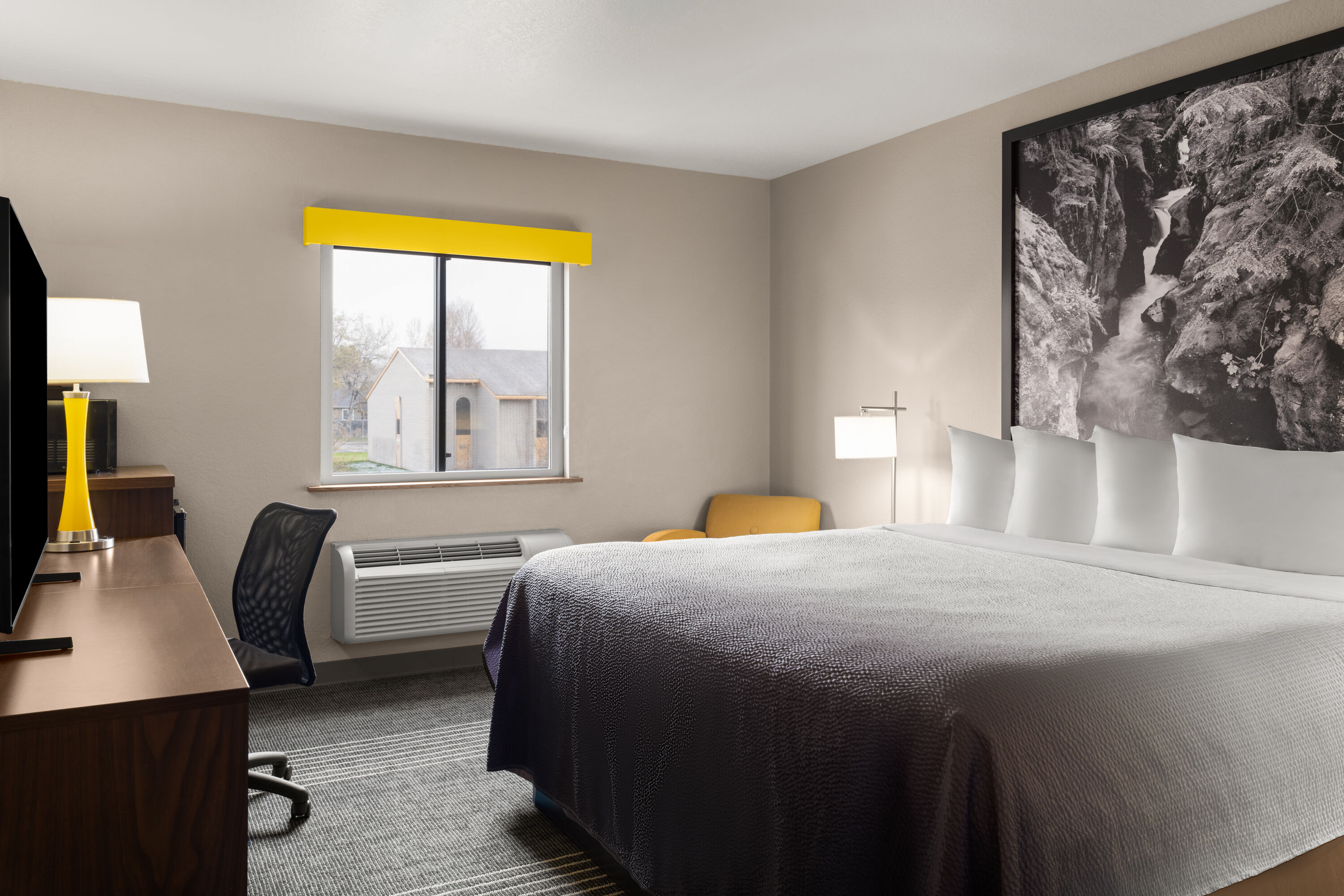 Guest room at the Super 8 by Wyndham Kalispell Glacier National Park in Kalispell, Montana