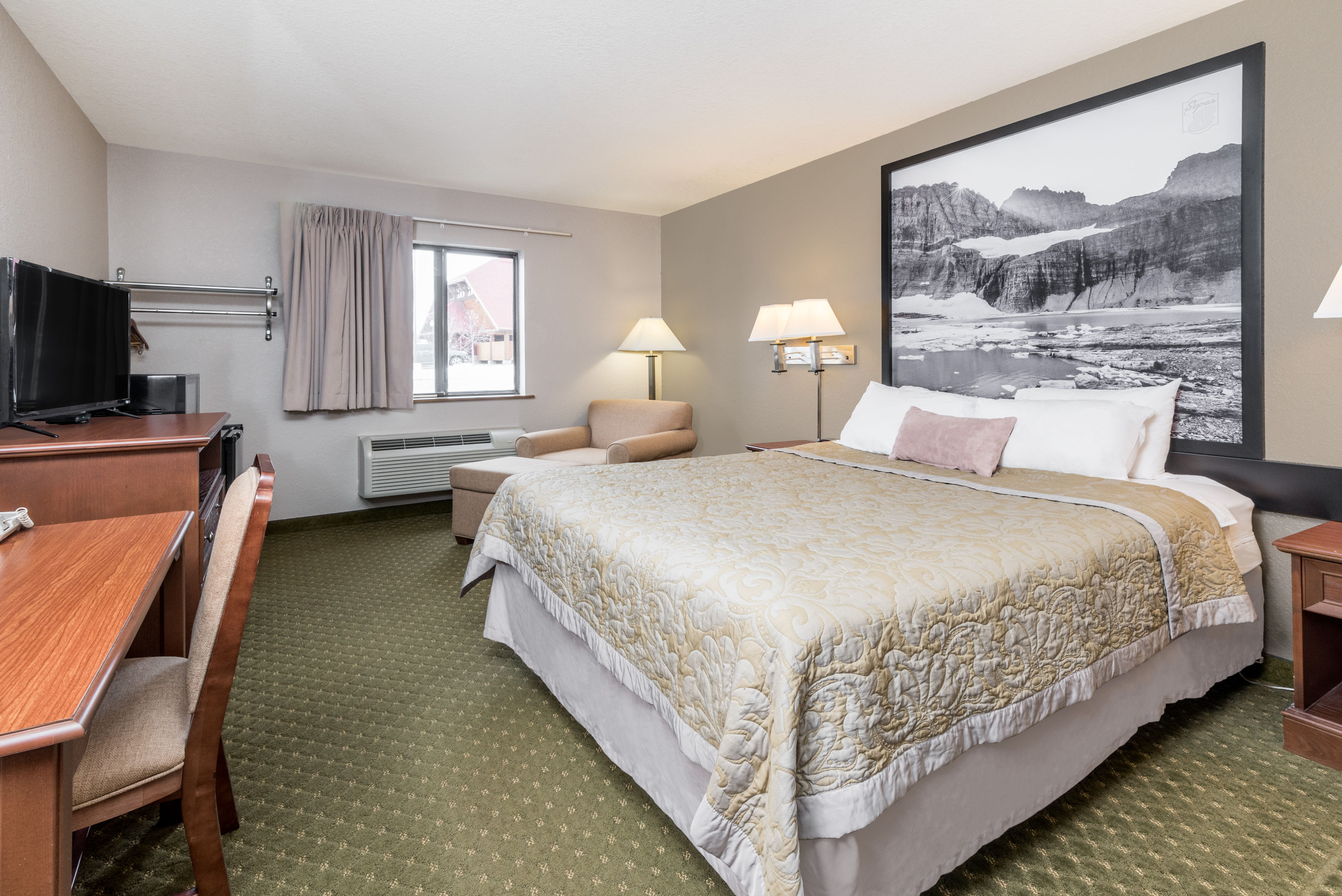 Guest room at the Super 8 by Wyndham Kalispell Glacier National Park in Kalispell, Montana