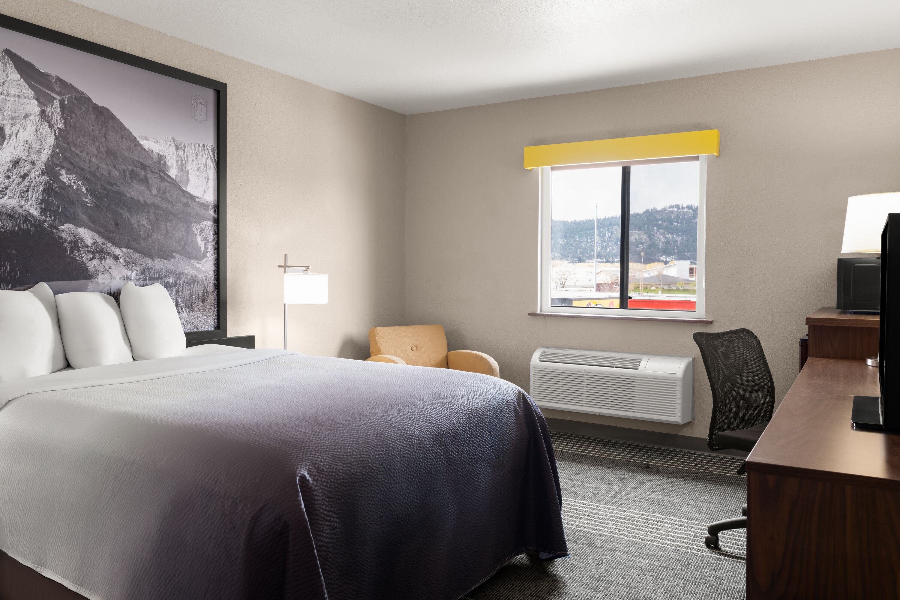 Guest room at the Super 8 by Wyndham Kalispell Glacier National Park in Kalispell, Montana