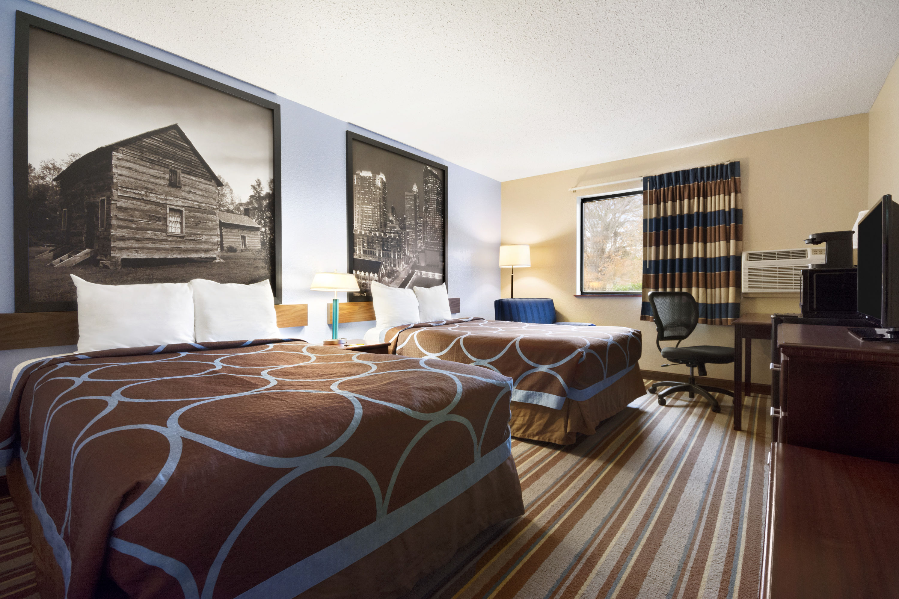 Guest room at the Super 8 by Wyndham Charlotte University in Charlotte, North Carolina