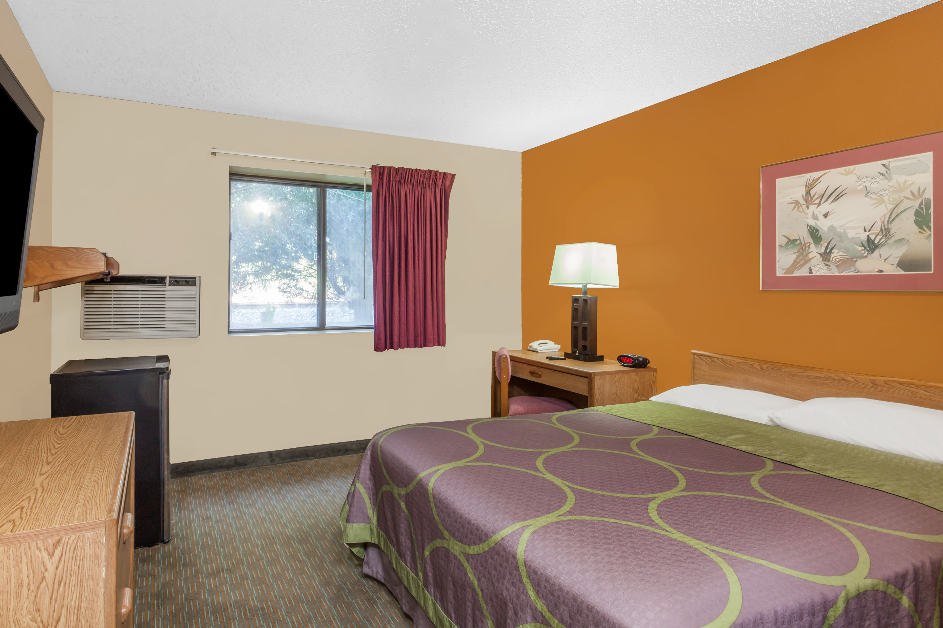 Guest room at the Super 8 by Wyndham Charlotte/Amusement Park Area in Charlotte, North Carolina