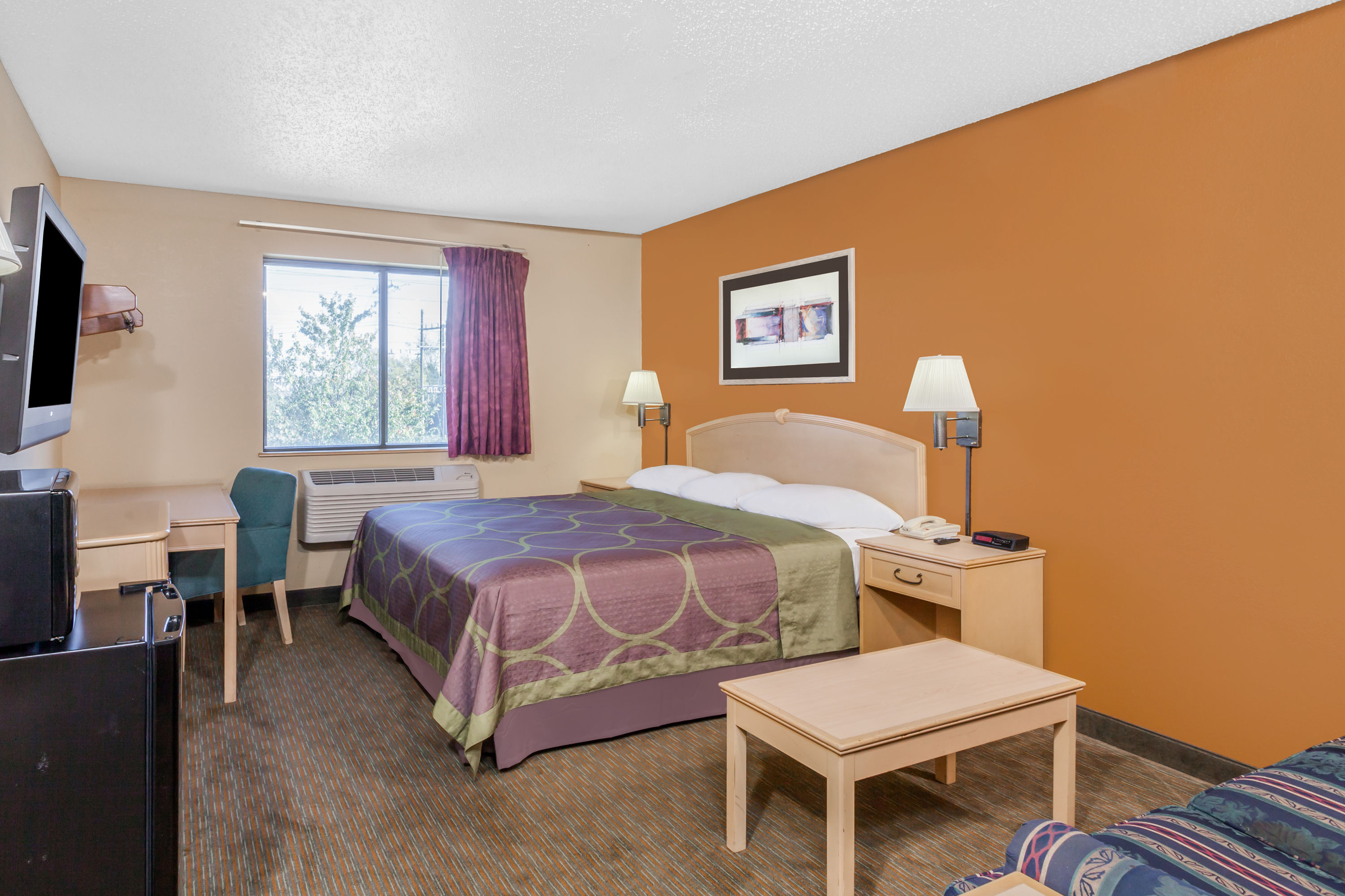 Guest room at the Super 8 by Wyndham Charlotte/Amusement Park Area in Charlotte, North Carolina