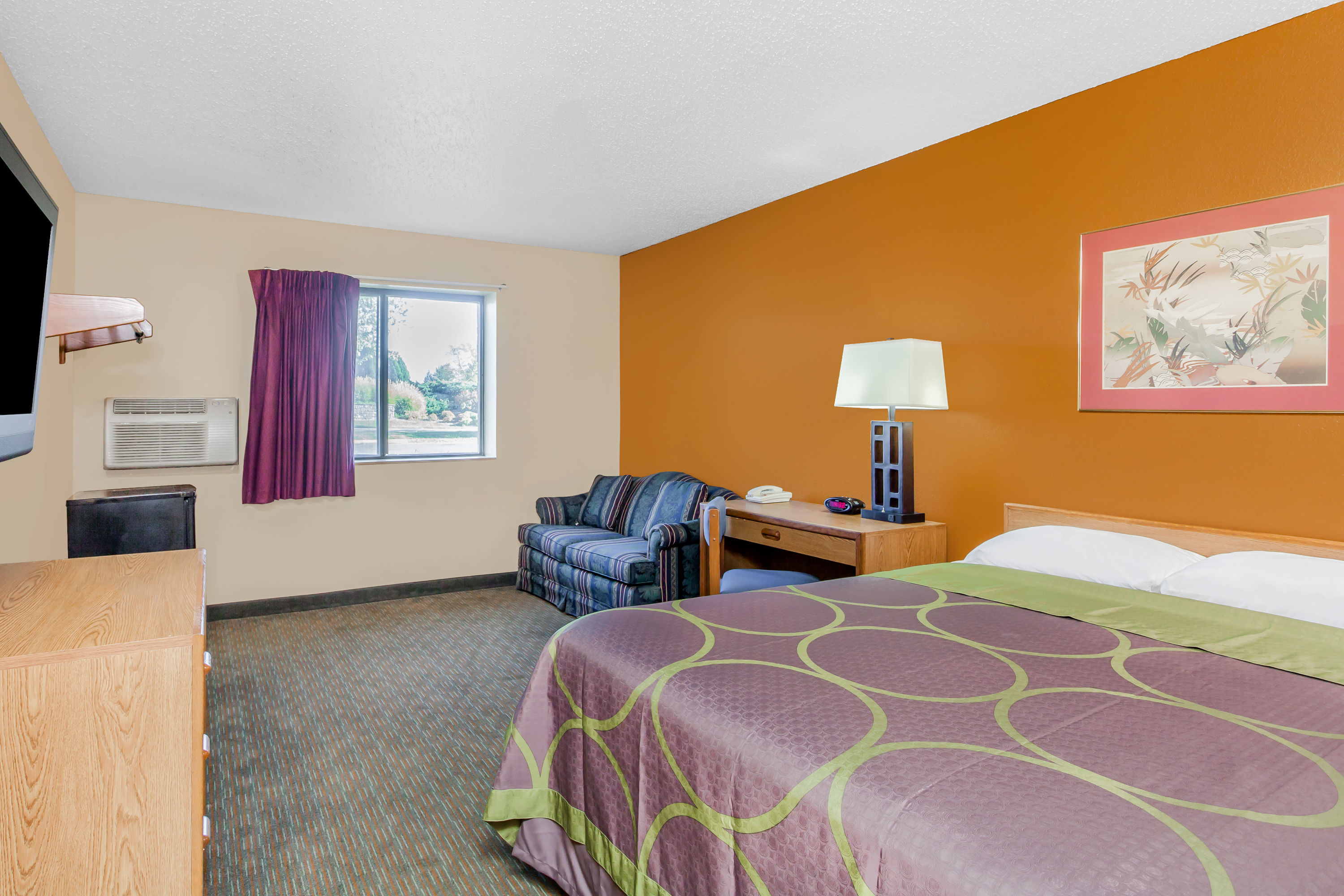 Guest room at the Super 8 by Wyndham Charlotte/Amusement Park Area in Charlotte, North Carolina