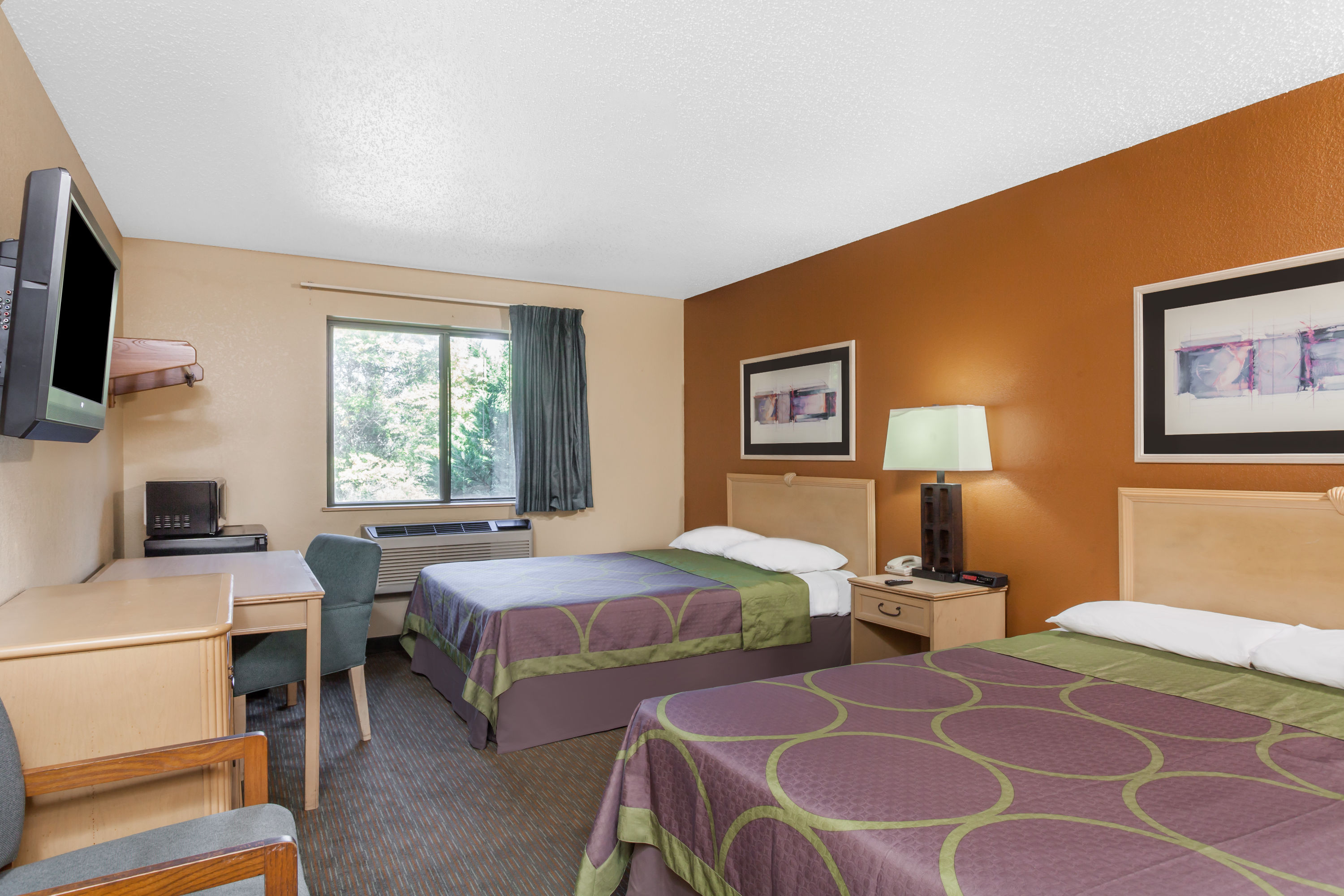 Guest room at the Super 8 by Wyndham Charlotte/Amusement Park Area in Charlotte, North Carolina