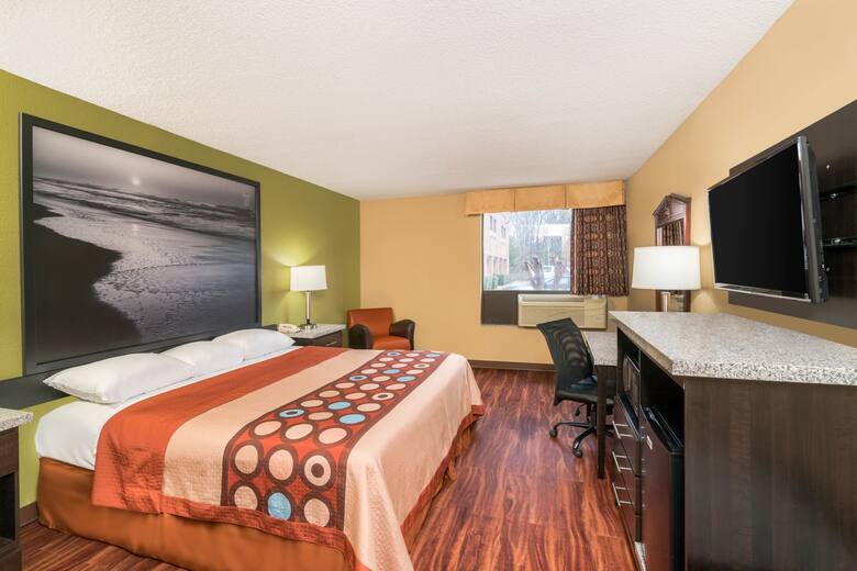 Guest room at the Super 8 Raleigh North East in Raleigh, North Carolina