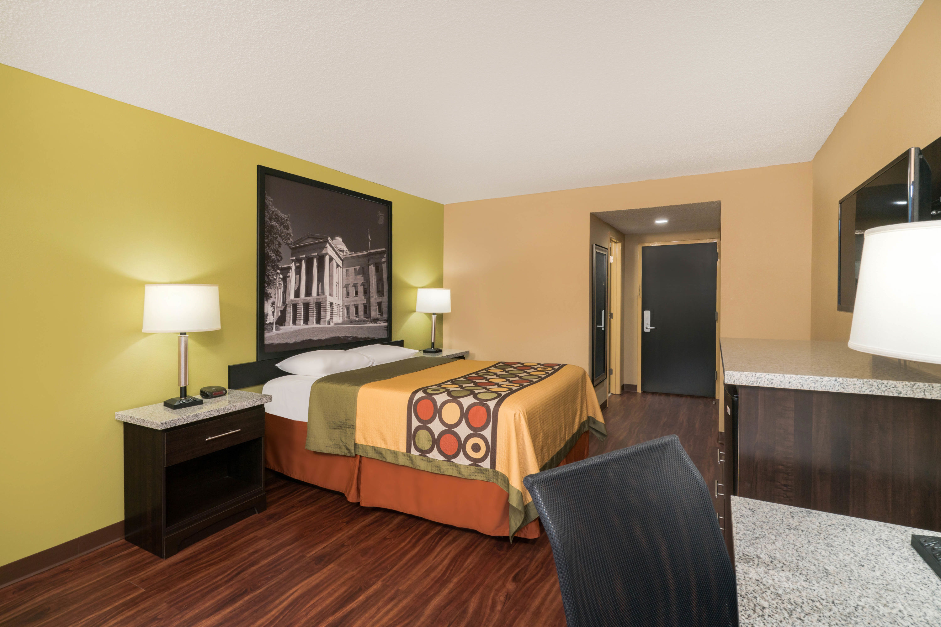 Guest room at the Super 8 by Wyndham Raleigh North East in Raleigh, North Carolina