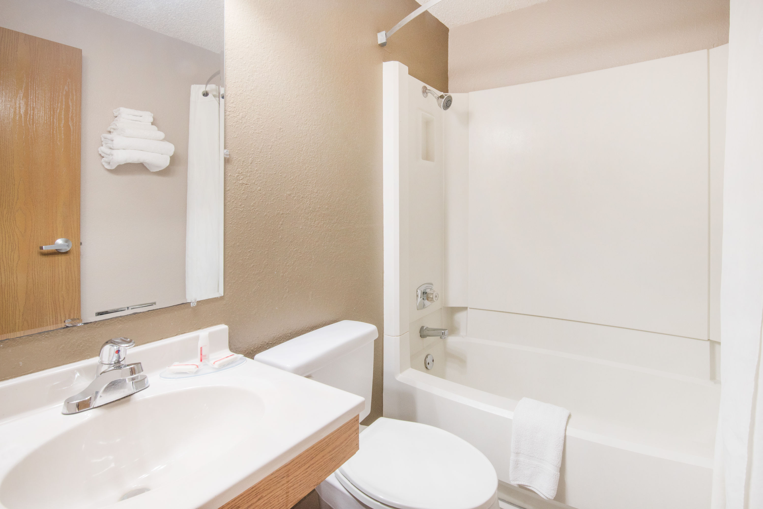 Guest room bath at the Super 8 by Wyndham Jamestown in Jamestown, North Dakota