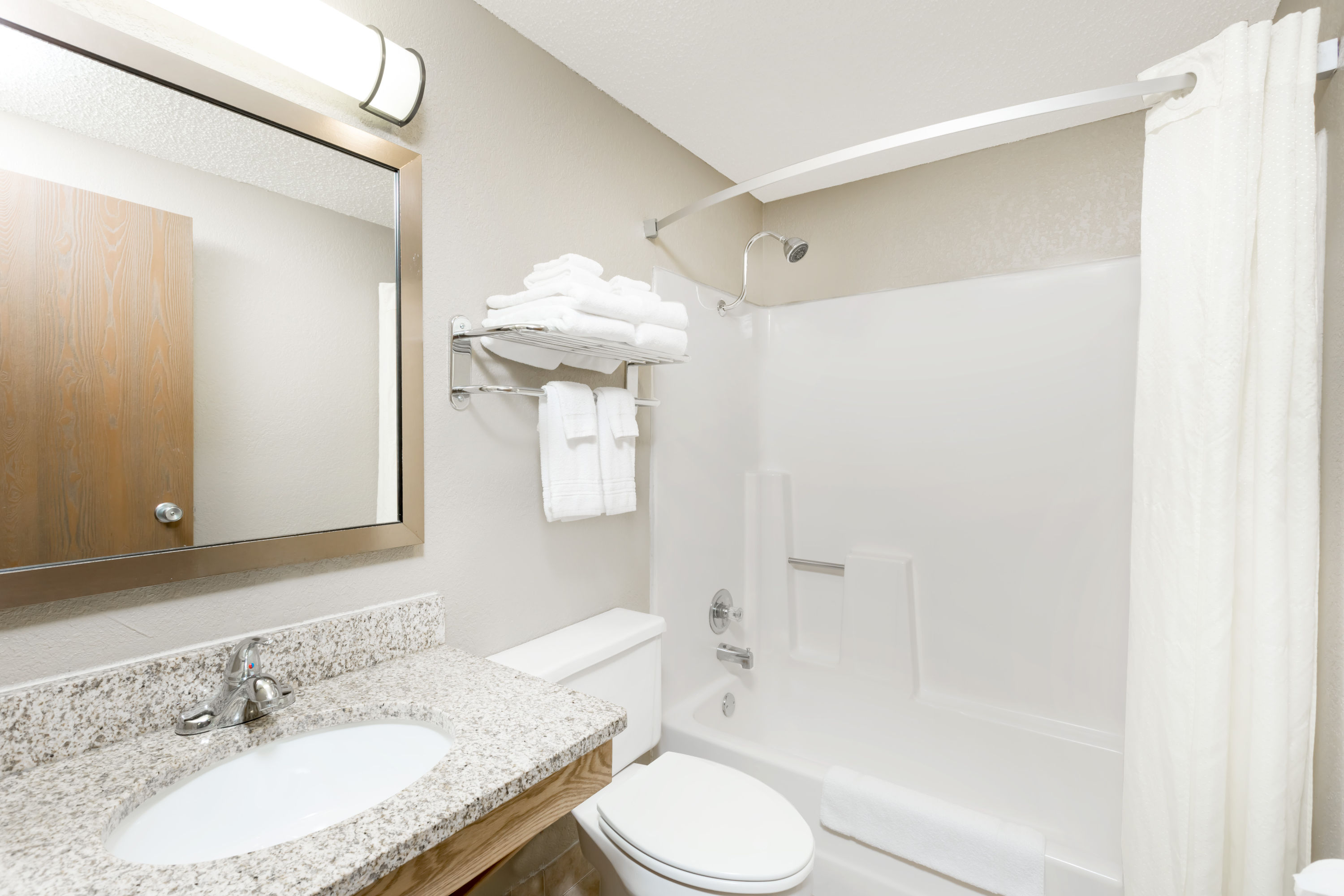 Guest room bath at the Super 8 by Wyndham Kearney in Kearney, Nebraska