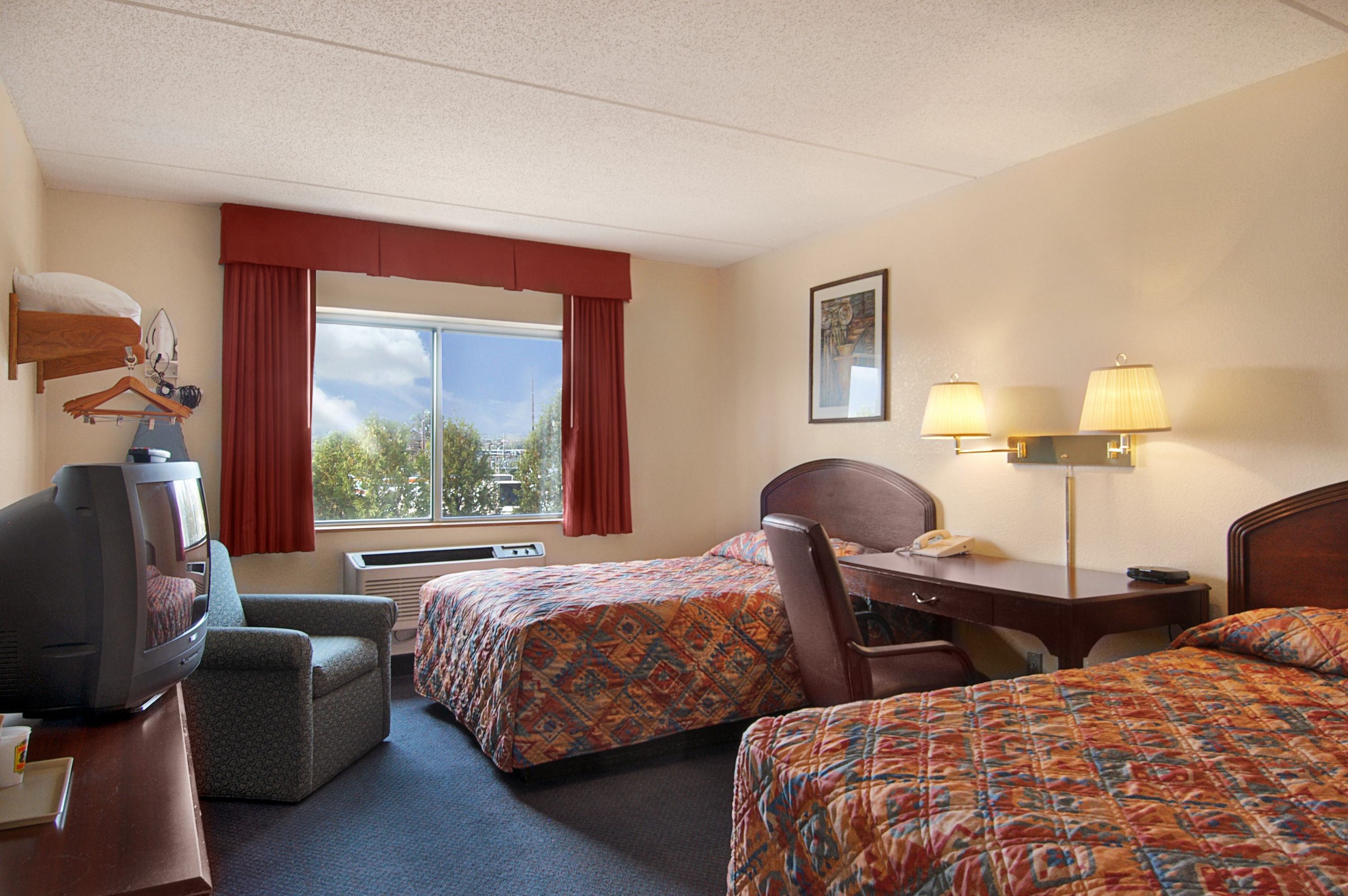 Guest room at the Super 8 by Wyndham Manchester Airport in Manchester, New Hampshire