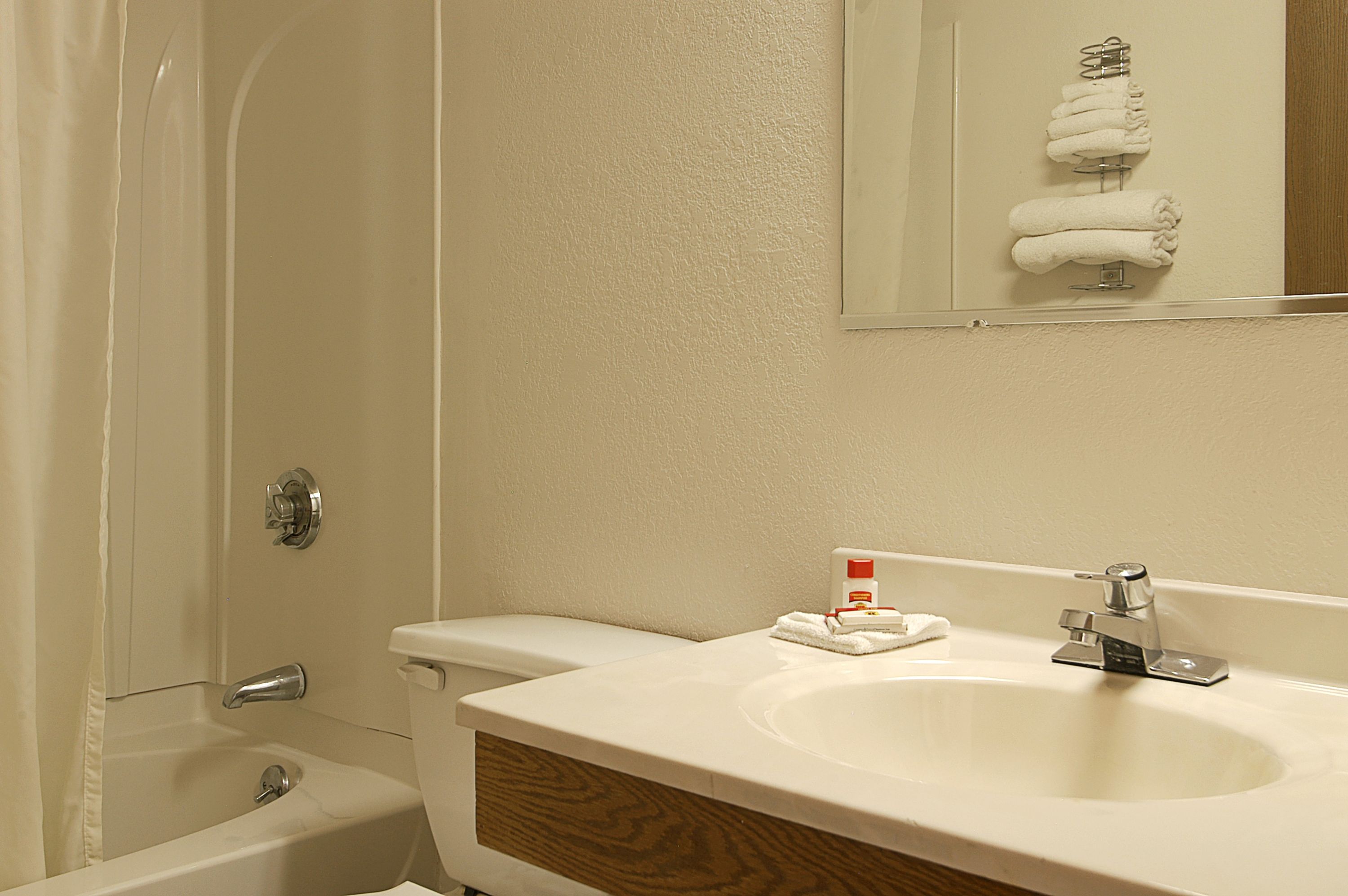 Guest room at the Super 8 by Wyndham Manchester Airport in Manchester, New Hampshire