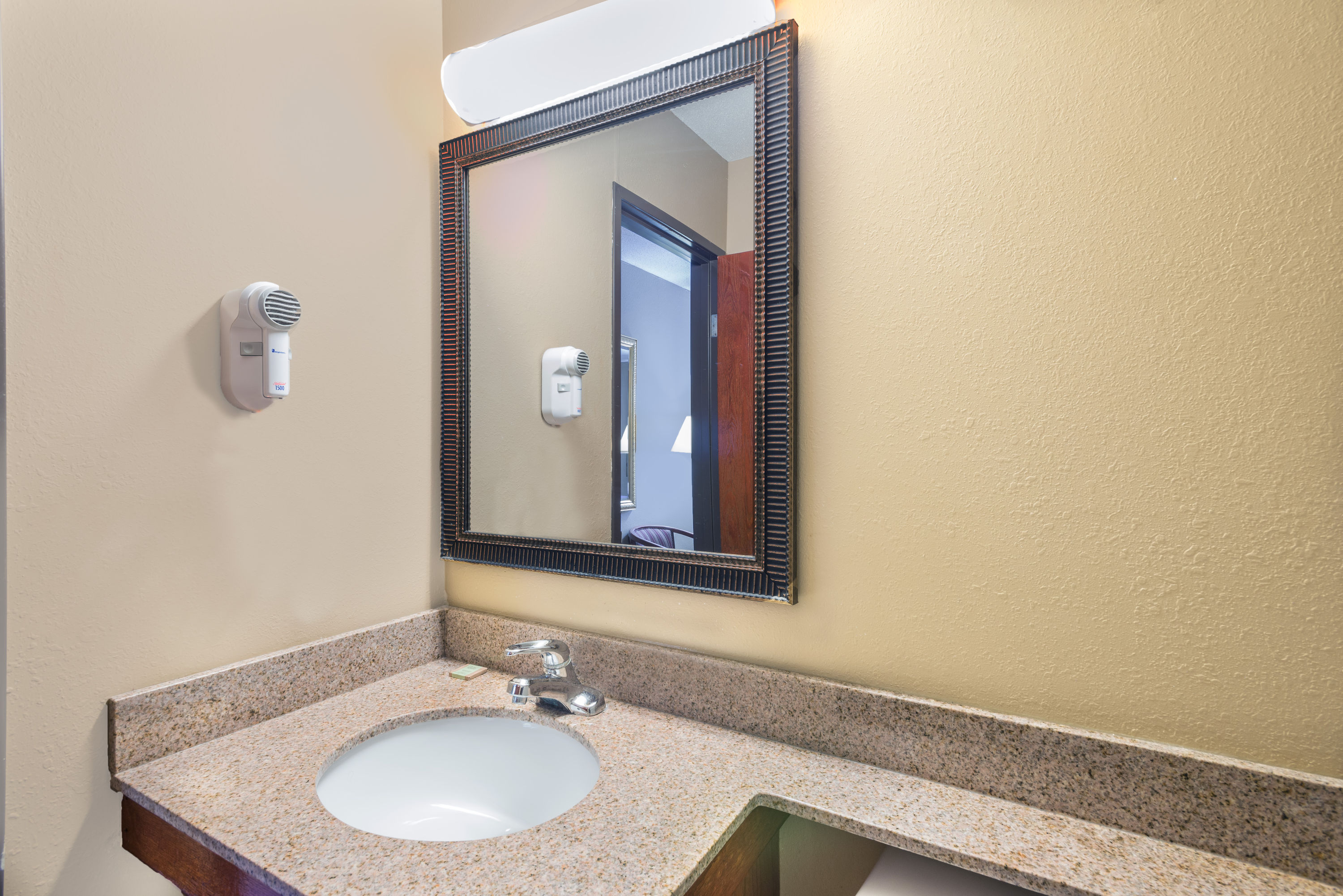 Guest room bath at the Super 8 by Wyndham Tilton/Lake Winnipesaukee in Tilton, New Hampshire