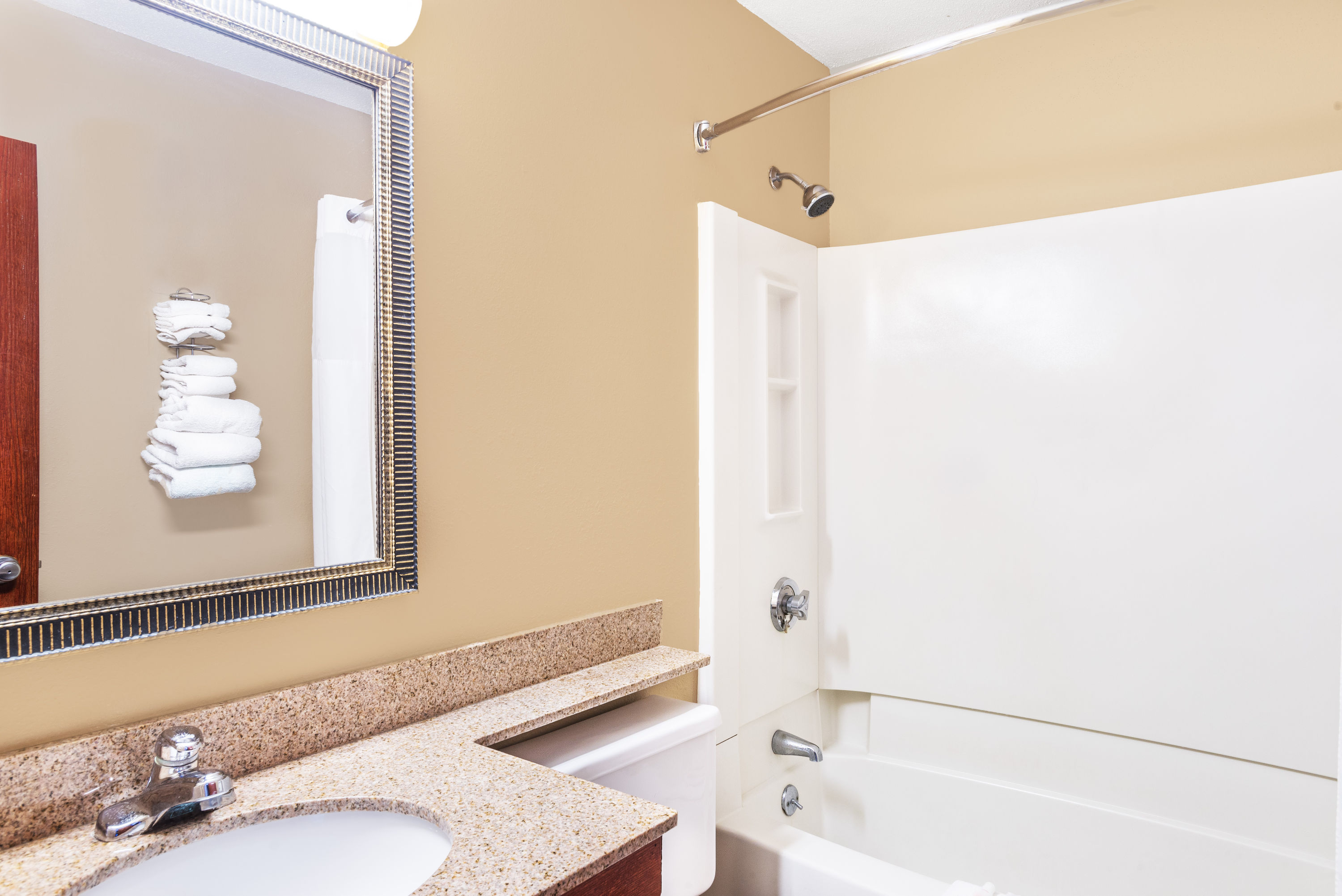 Guest room bath at the Super 8 by Wyndham Tilton/Lake Winnipesaukee in Tilton, New Hampshire